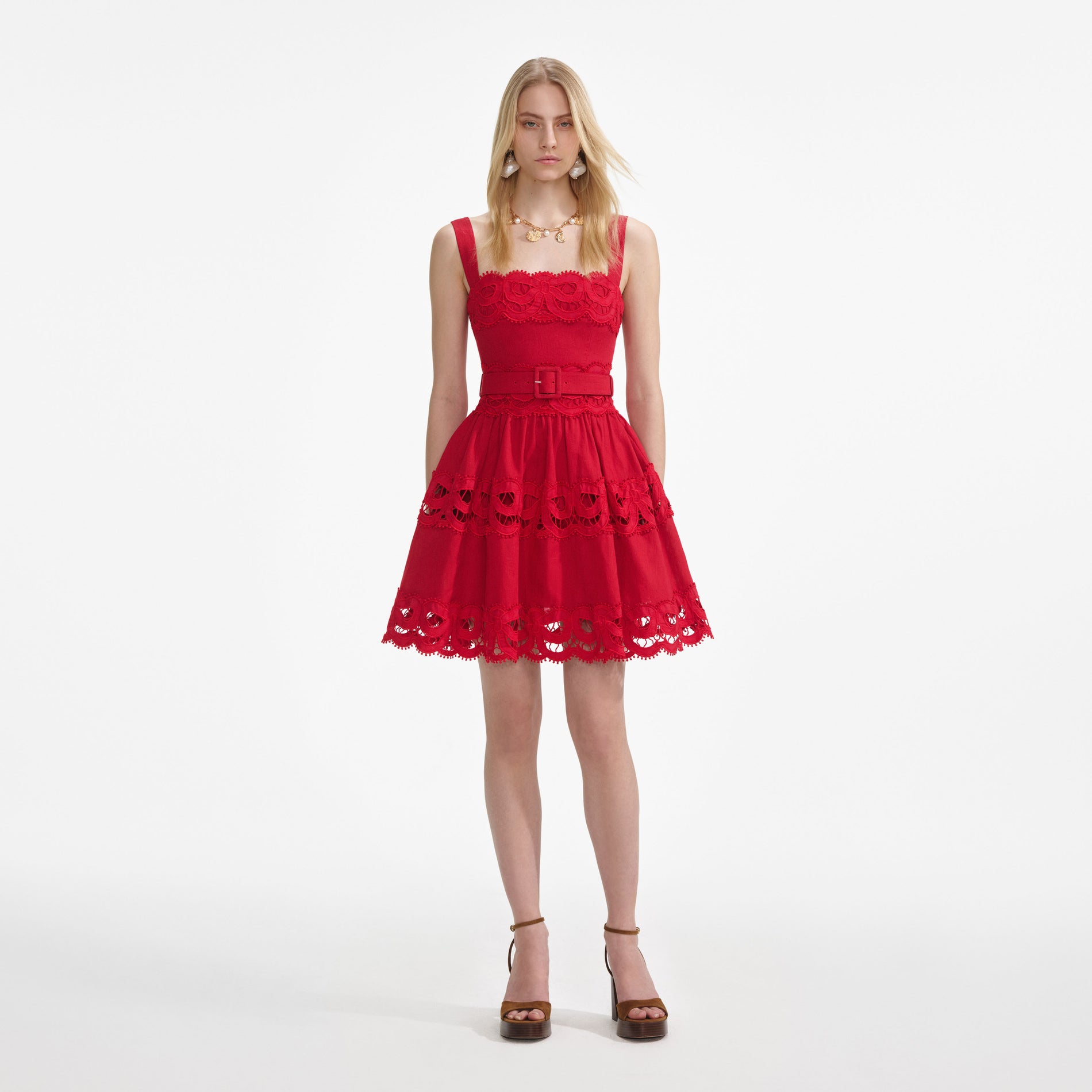 Front view of a woman wearing the Red Linen Lace Insert Mini Dress
