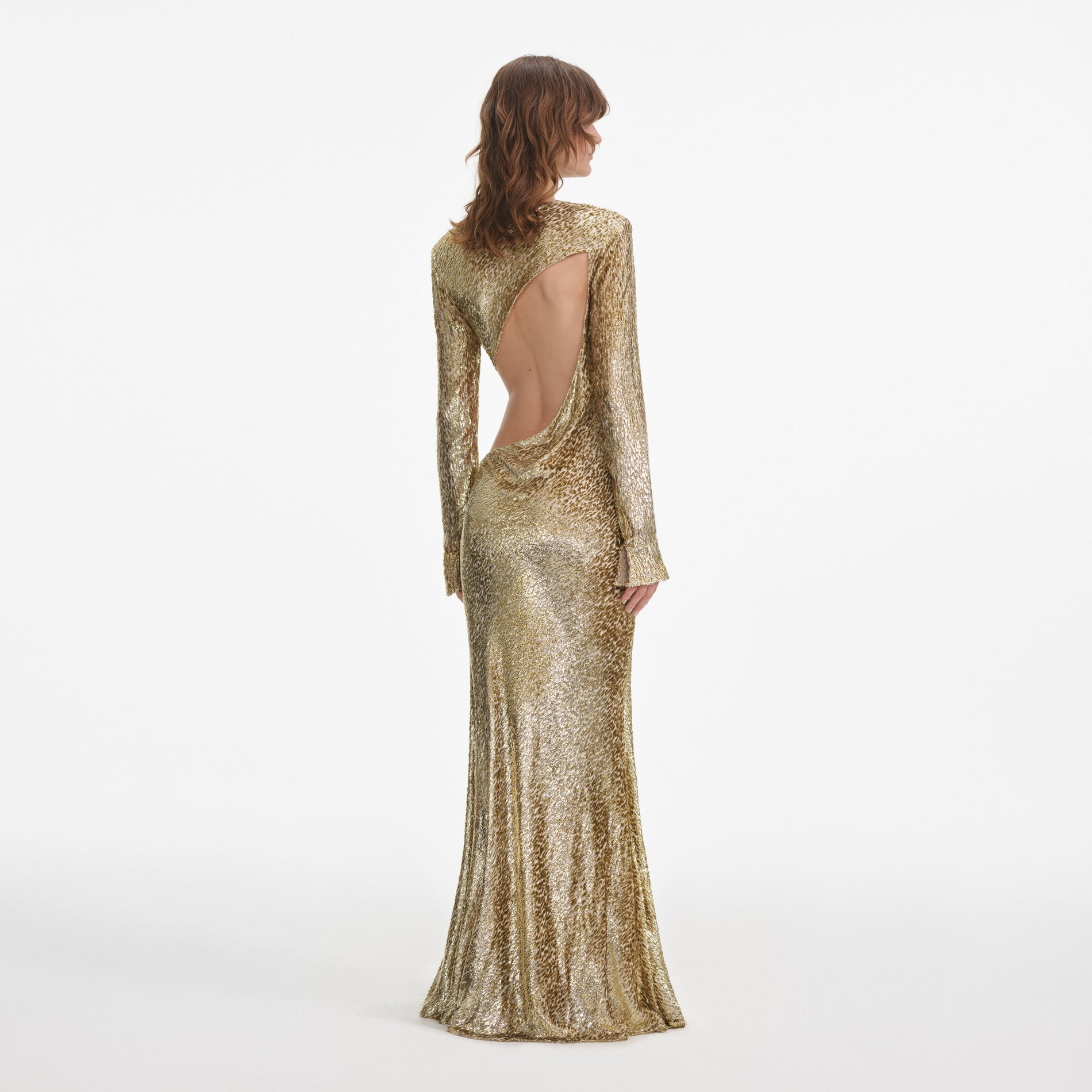 Back view of a woman wearing the Gold Fil Coupe Maxi Dress