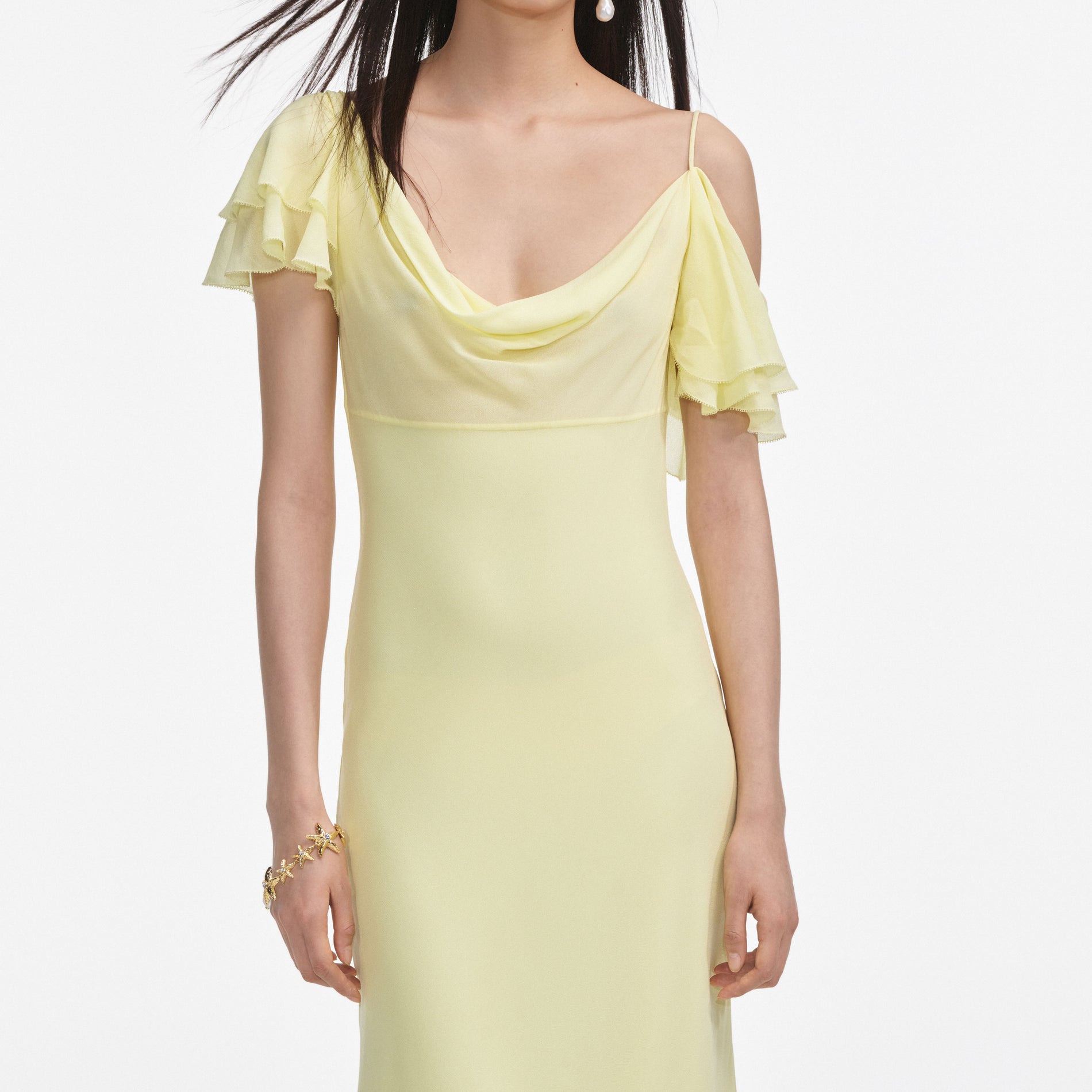 A close up of a woman wearing the Yellow Georgette Frill Midi Dress