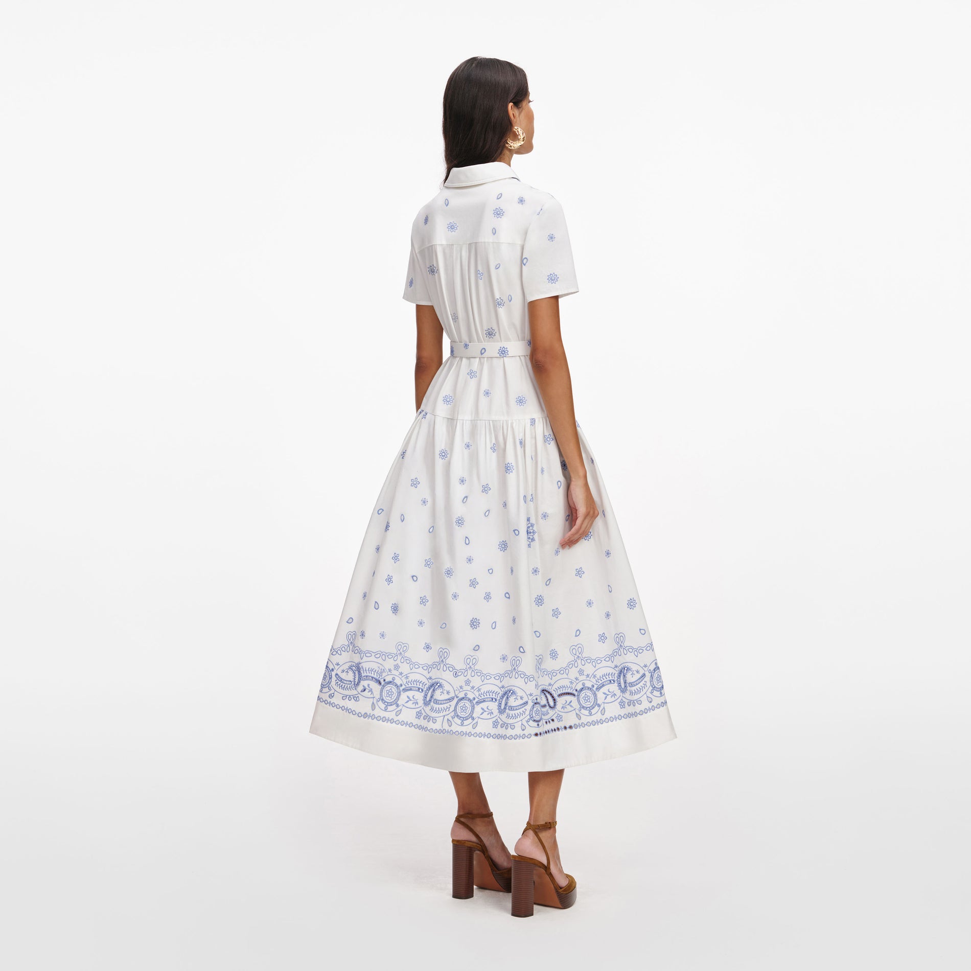 Back view of a woman wearing the White And Blue Embroidered Midi Dress