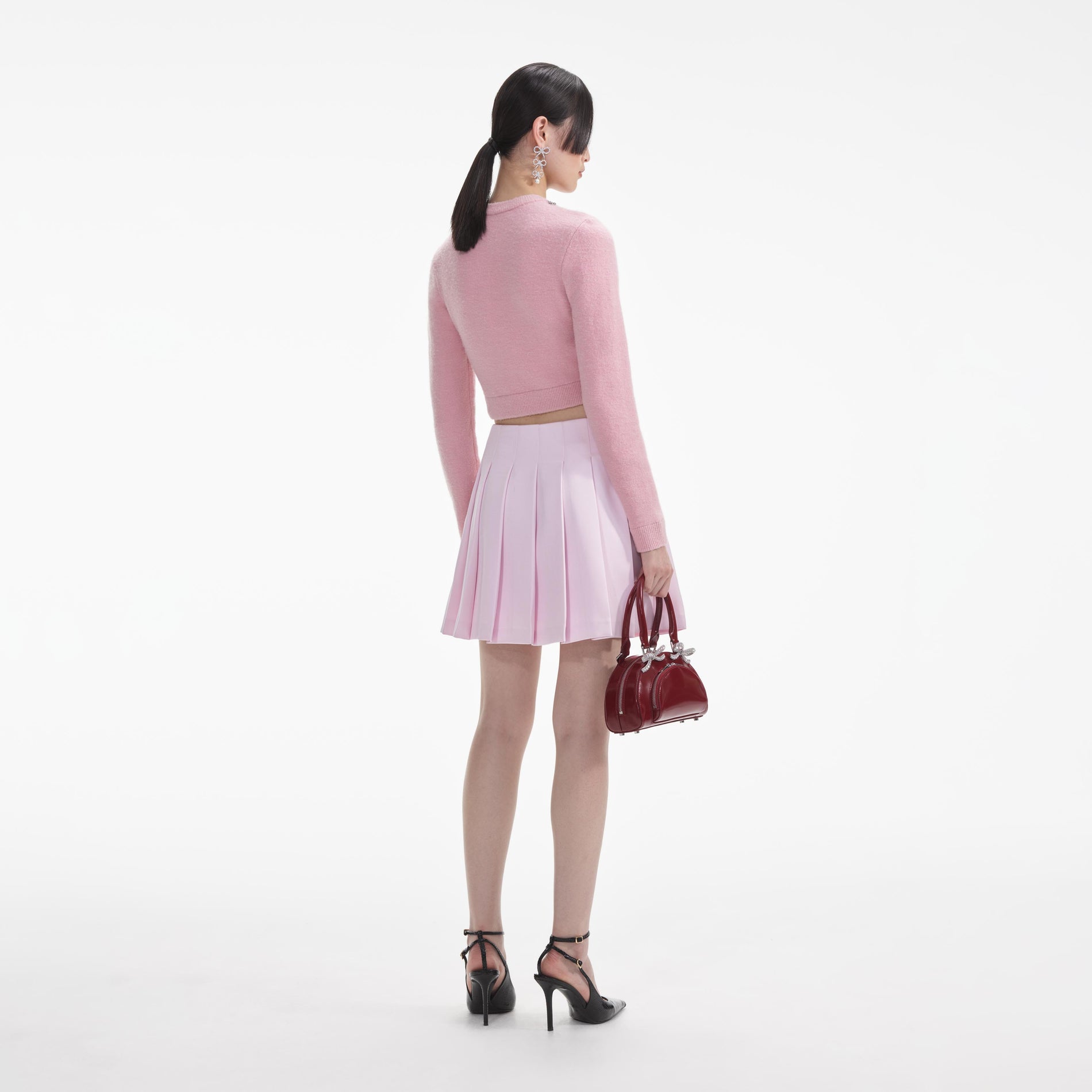 Back view of a woman wearing the White Pink Embellished Cardigan