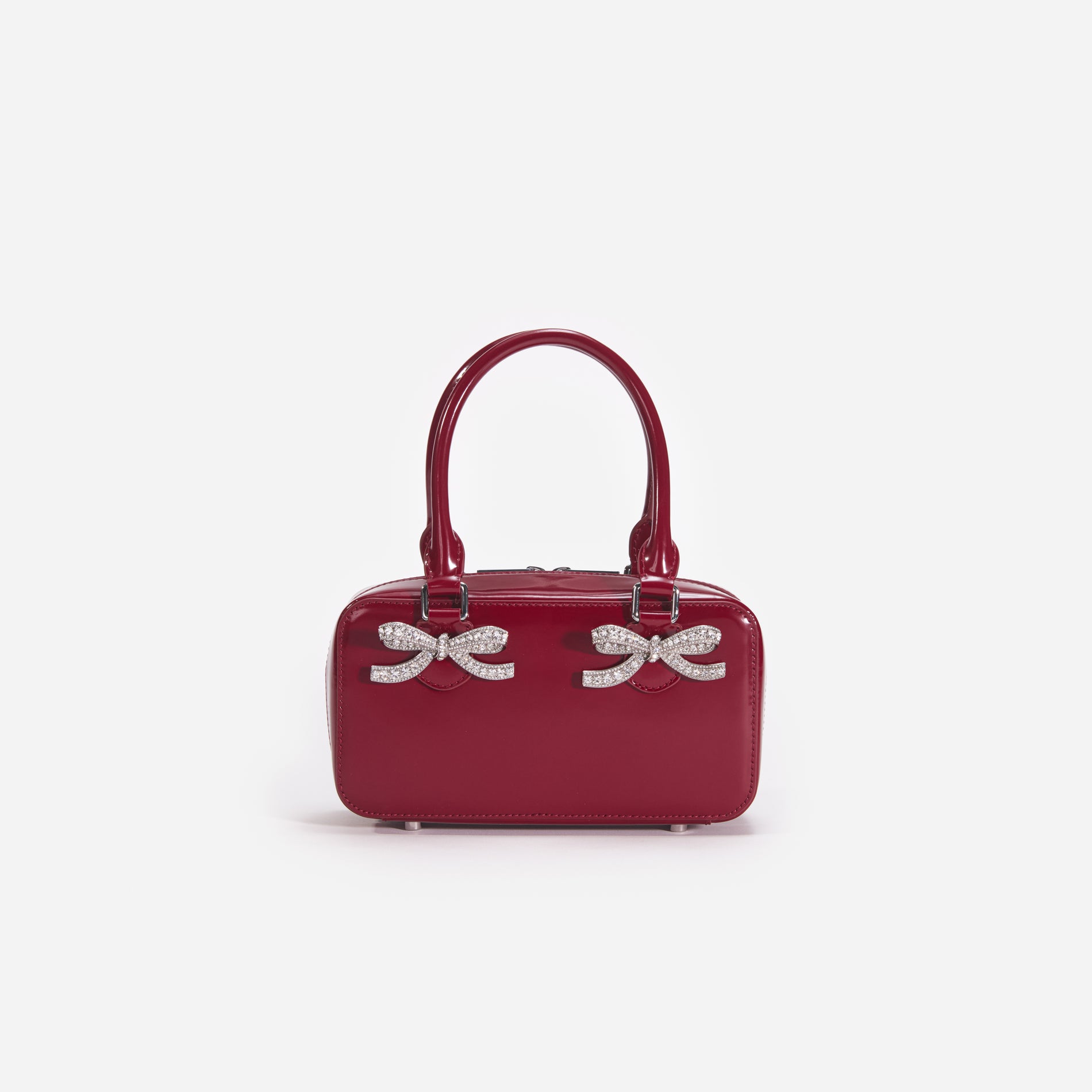 Front view of a woman wearing the Burgundy Leather Mini Tote Bag