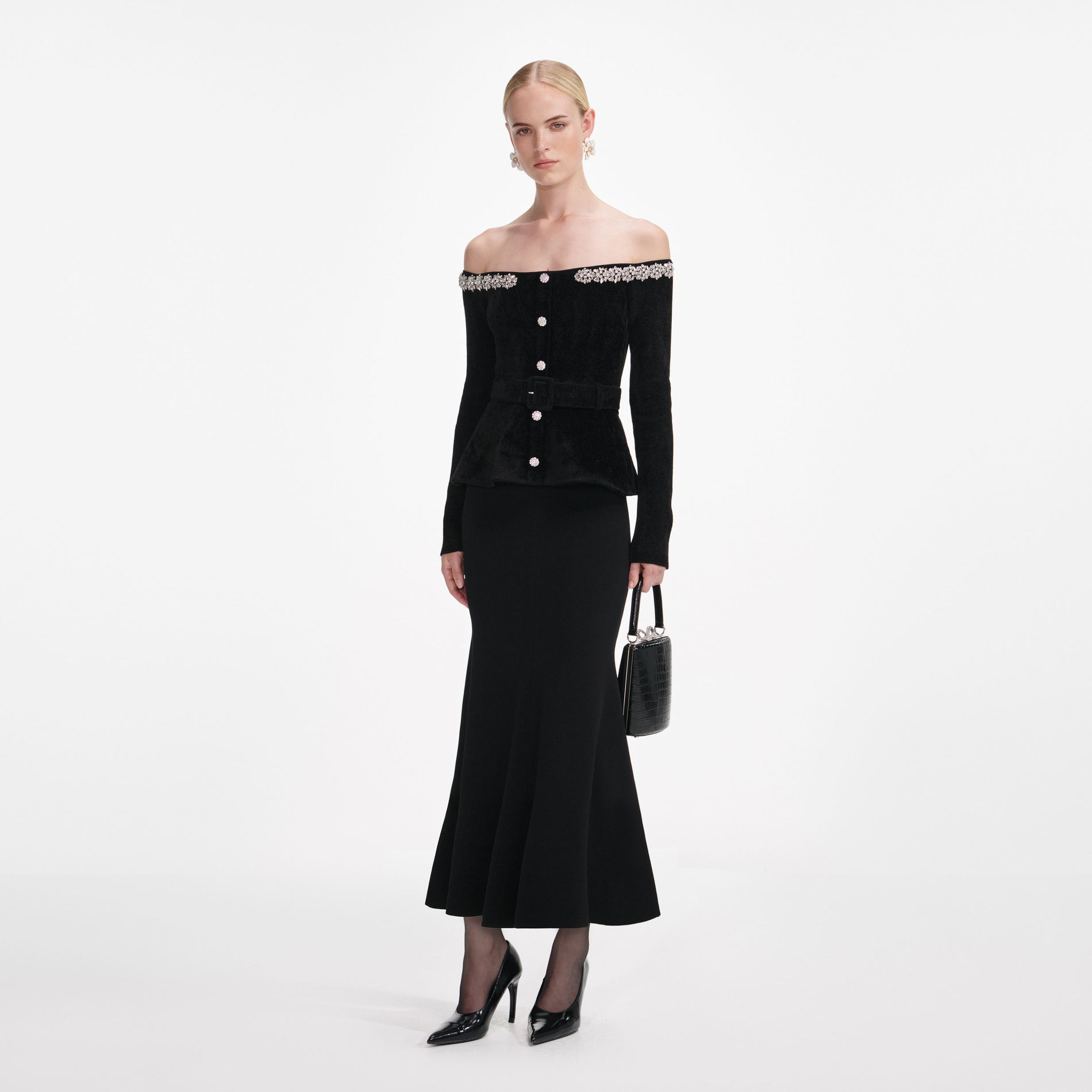 Side view of a woman wearing the Black Chenille Knit Crystal Trim Midi Dress