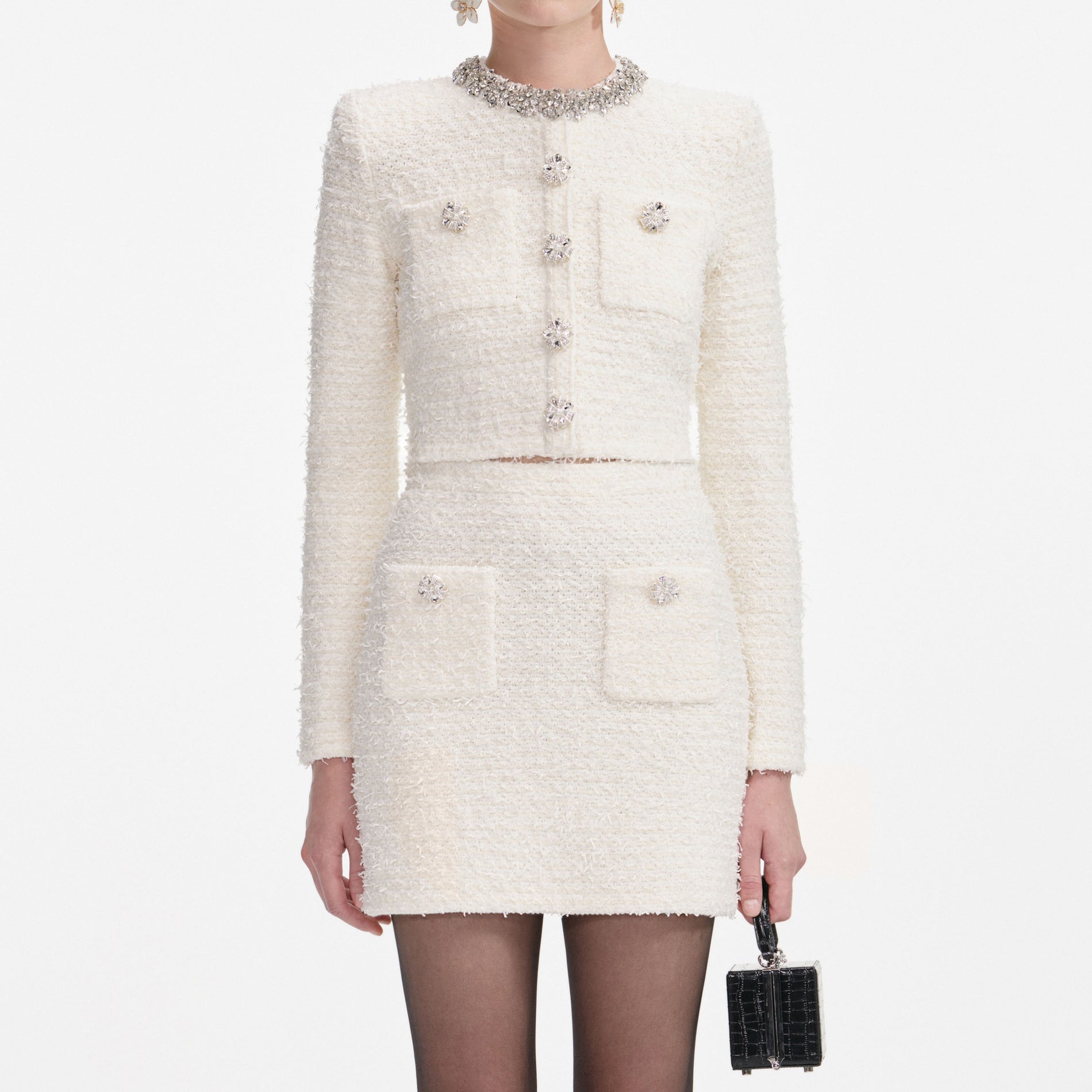 A close up of a woman wearing the Bordeaux Pointelle Knit Midi Dress