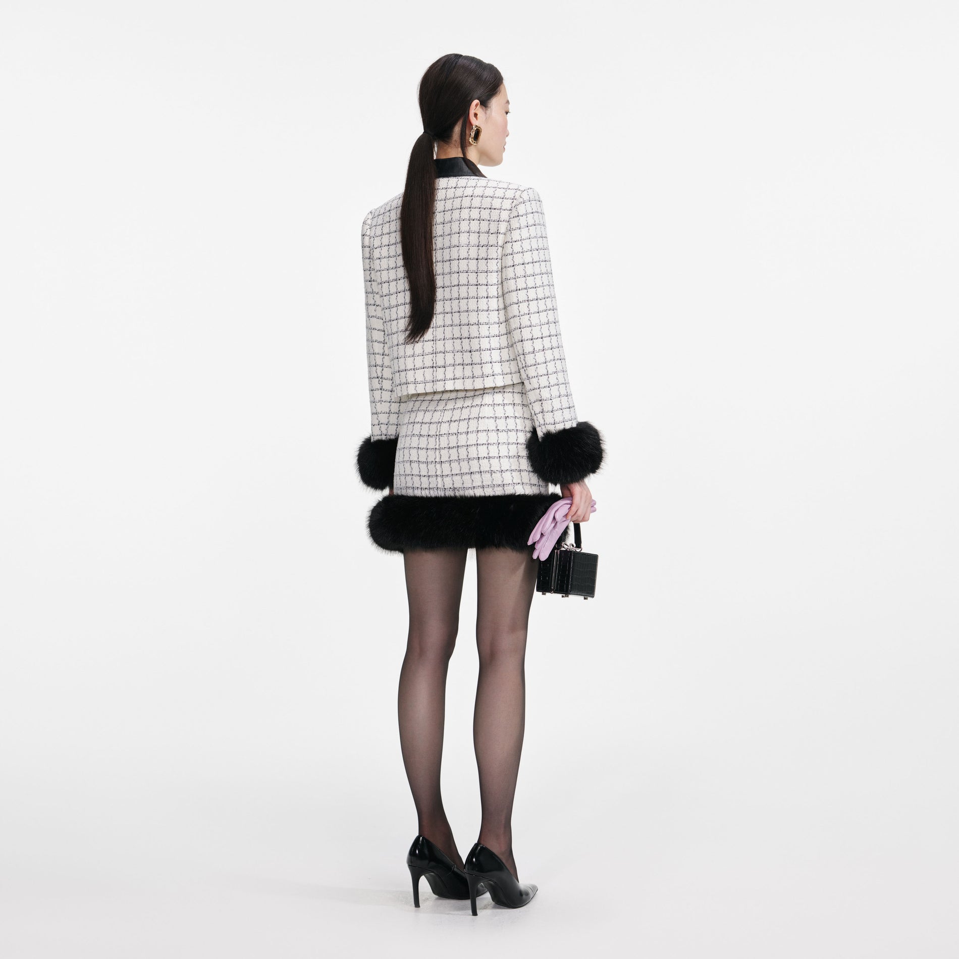 Back view of a woman wearing the Check Boucle Fur Cuff Jacket