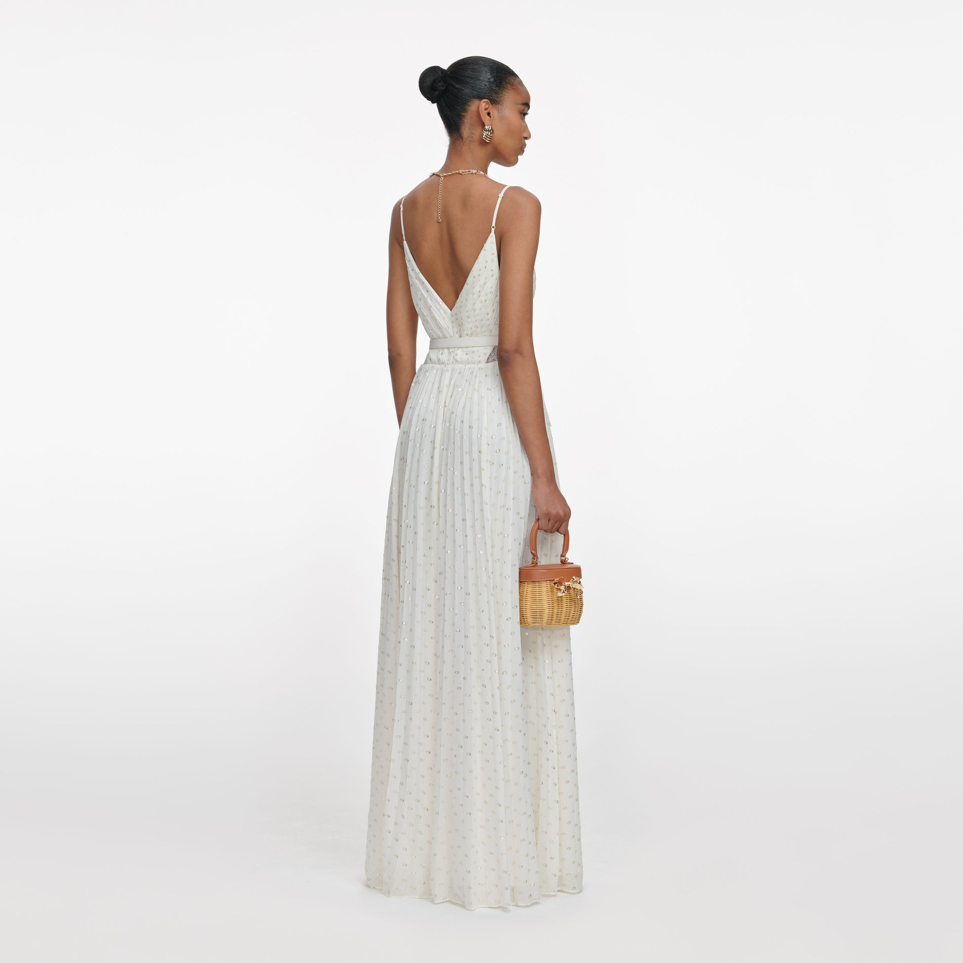 Back view of a woman wearing the Cream And Gold Chiffon Maxi Dress