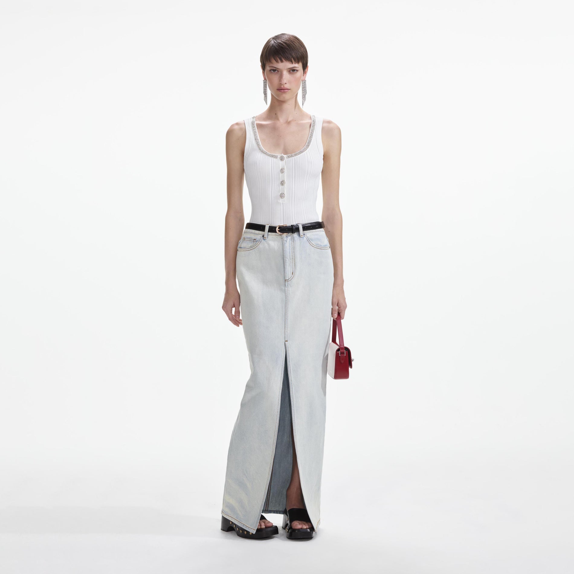 Front view of a woman wearing the Bleach Wash Denim Maxi Skirt