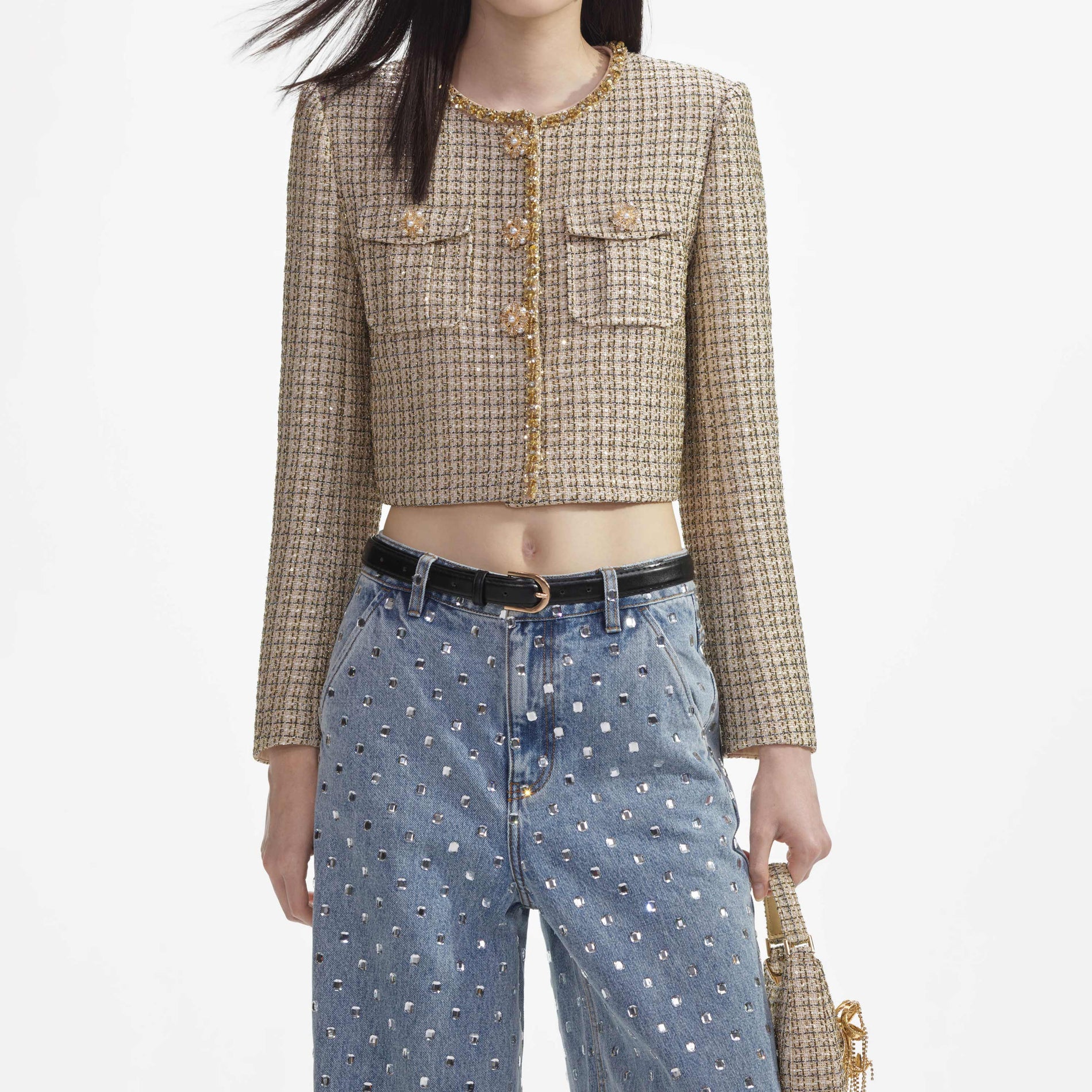A close up of a woman wearing the Gold Boucle Cropped Jacket