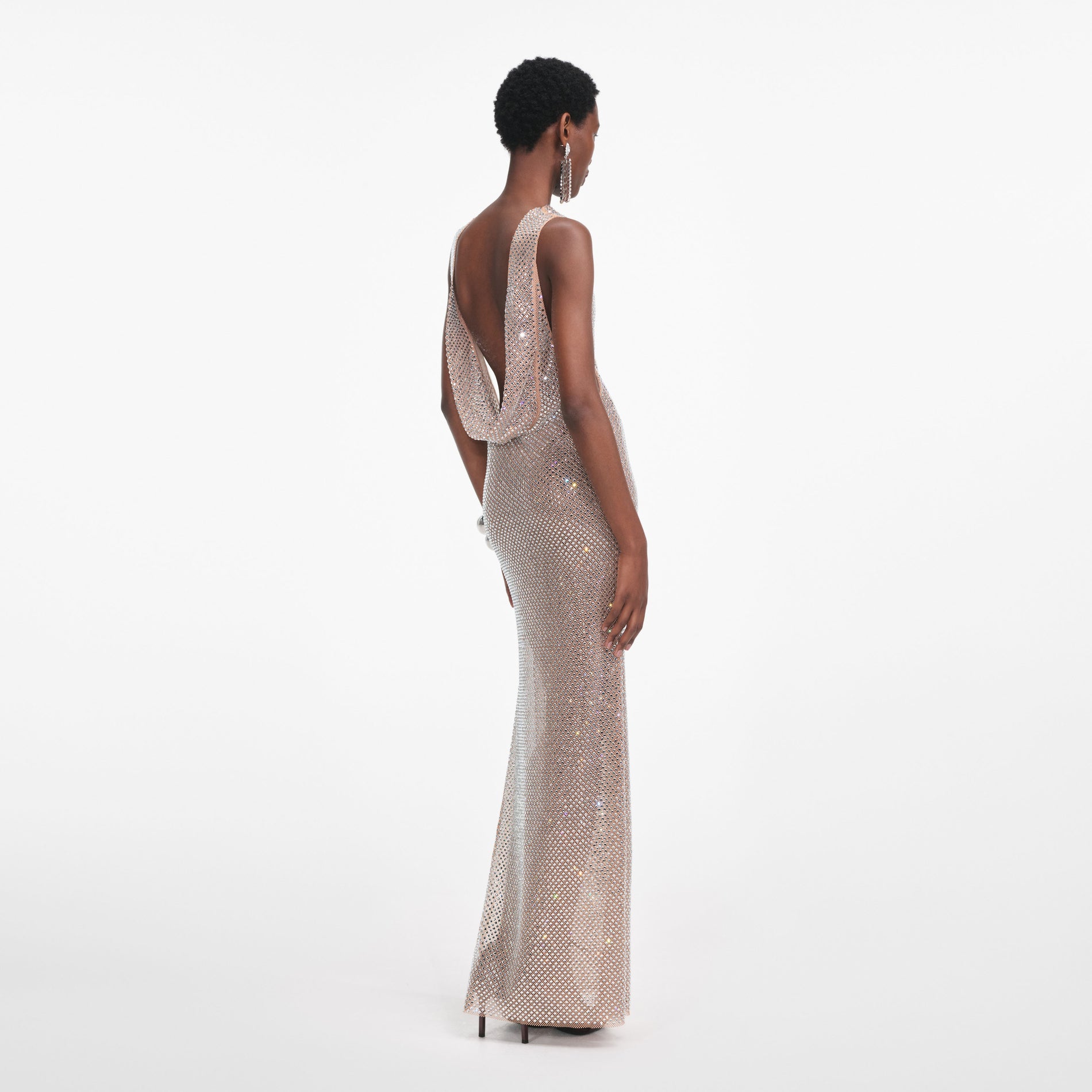 Back view of a woman wearing the Silver Rhinestone Drape Maxi Dress