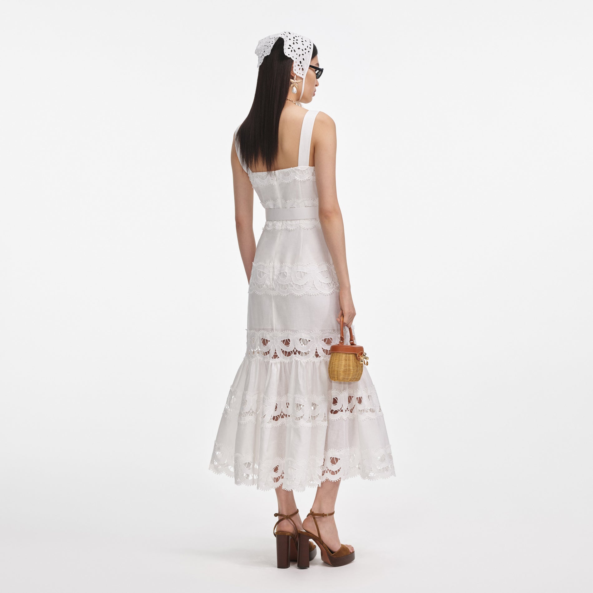 Back view of a woman wearing the White Linen Lace Insert Midi Dress