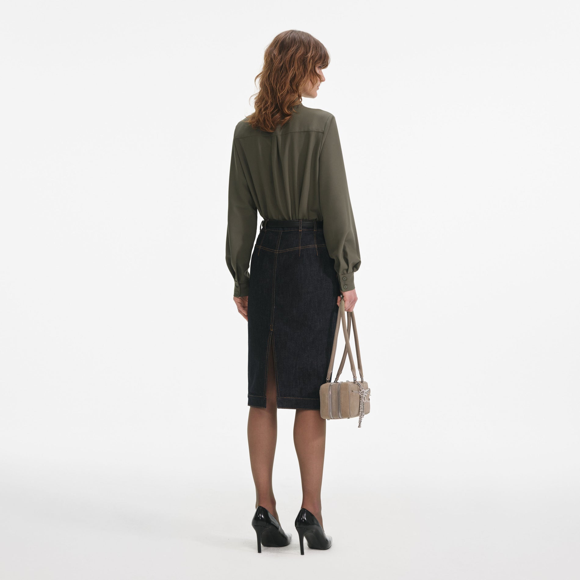 Back view of a woman wearing the Khaki Twill Pussy Bow Blouse