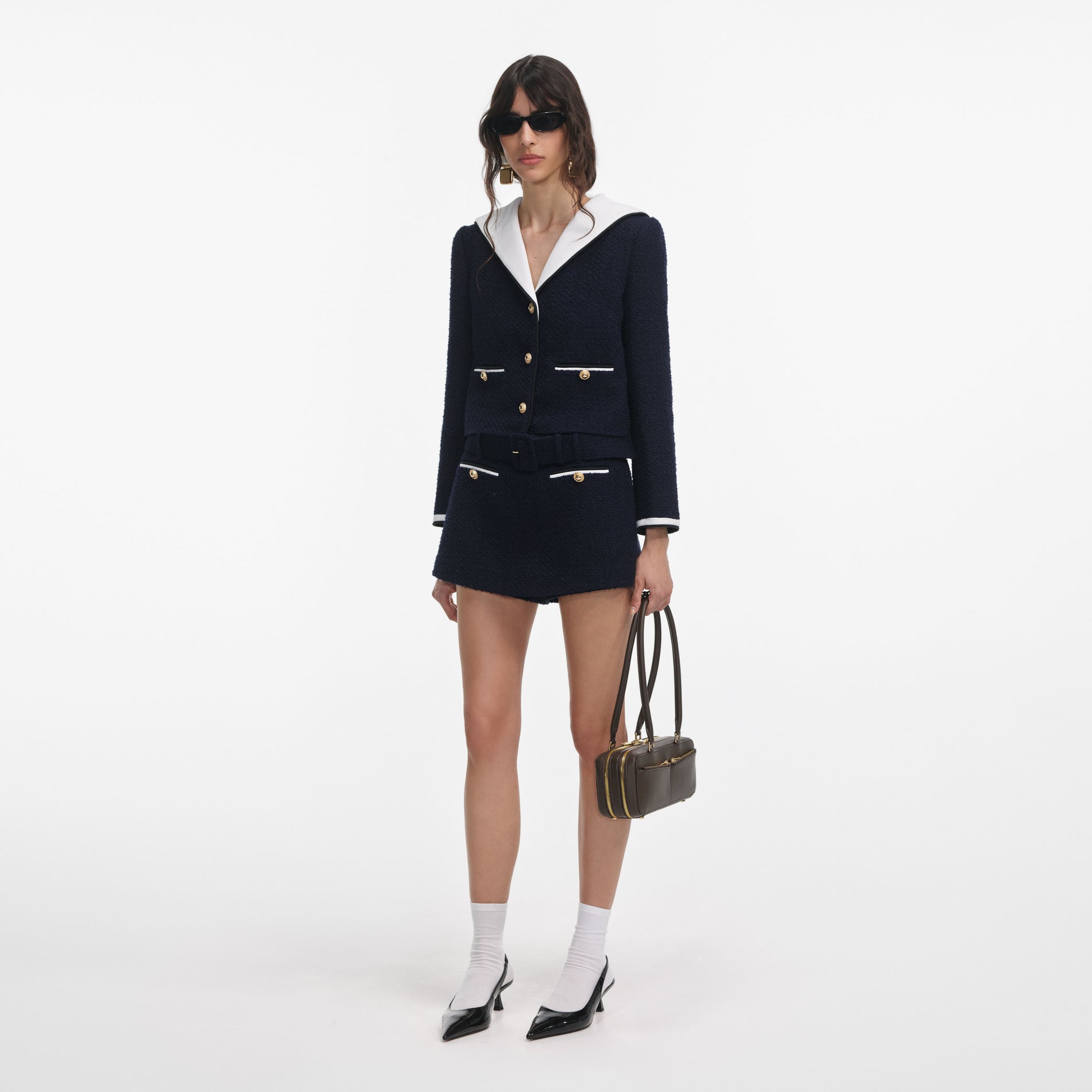 Side view of a woman wearing the Navy Boucle Contrast Collar Jacket