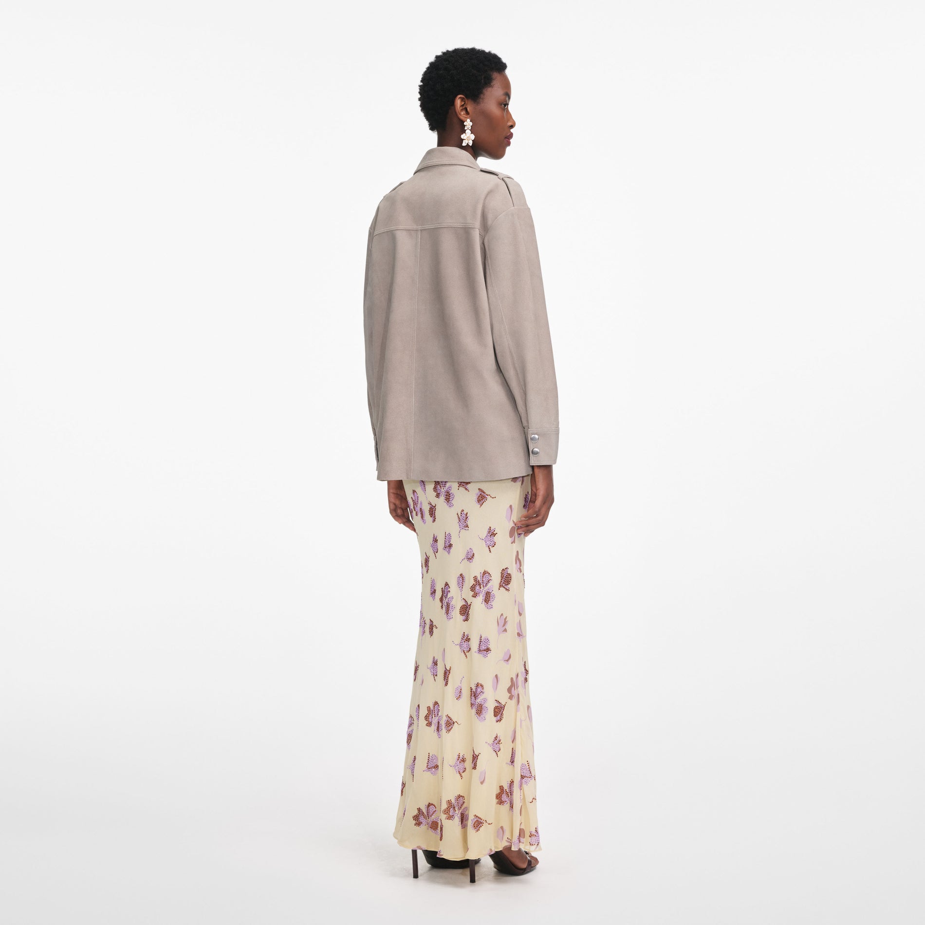 Back view of a woman wearing the Grey Suede Jacket