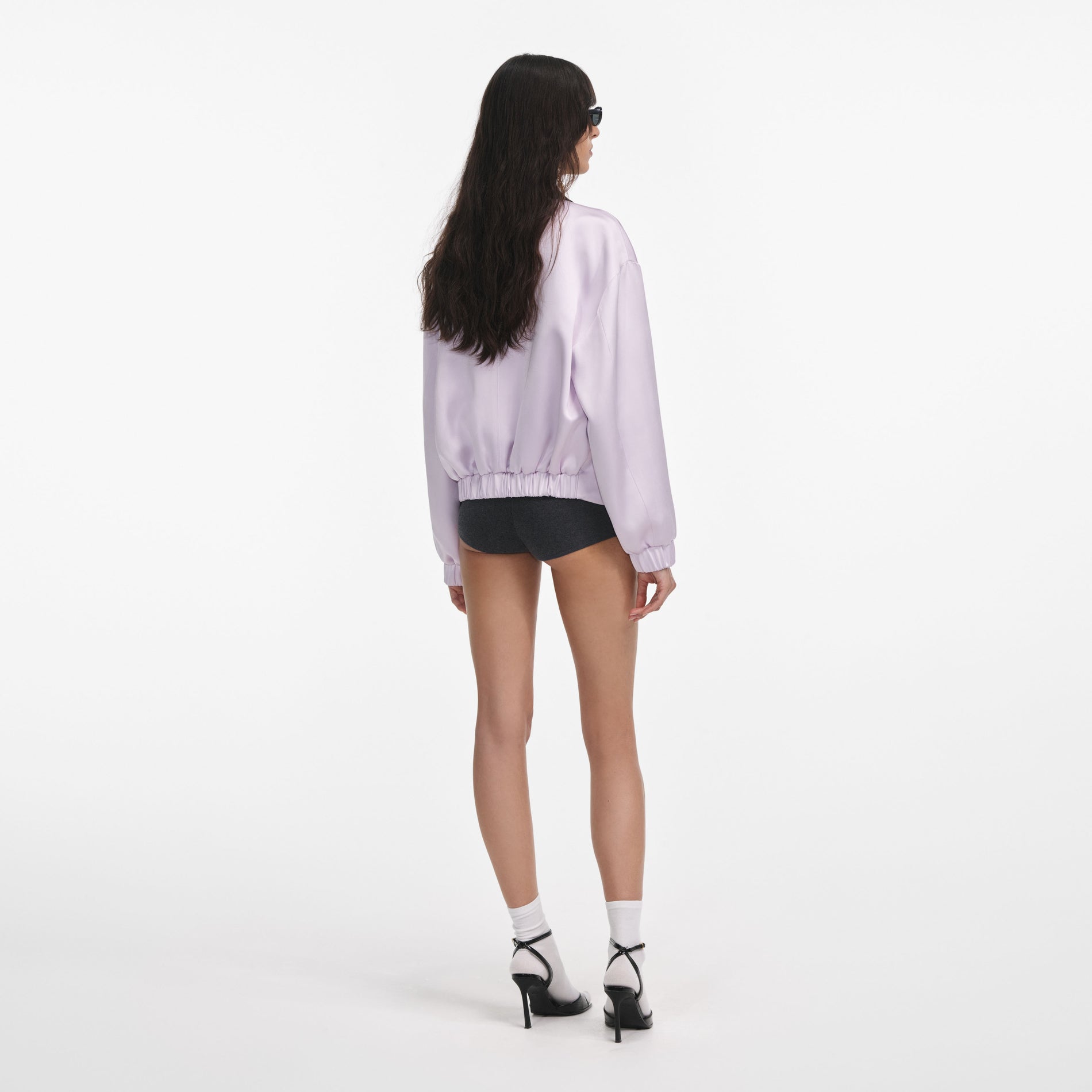 Back view of a woman wearing the Lilac Viscose Jacket