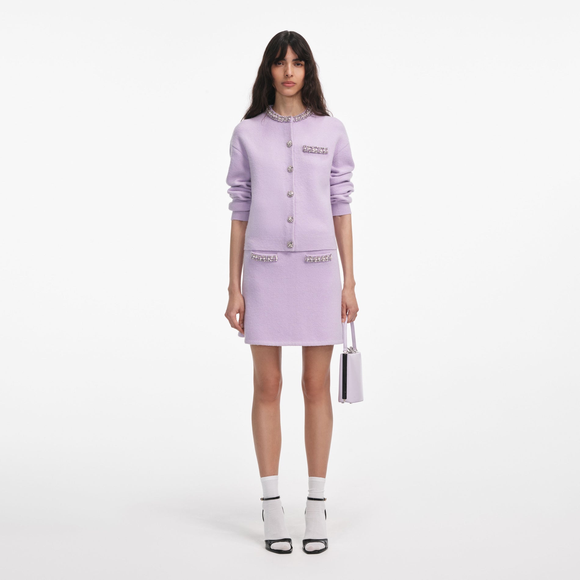 Front view of a woman wearing the Lilac Crystal Trim Knit Skirt