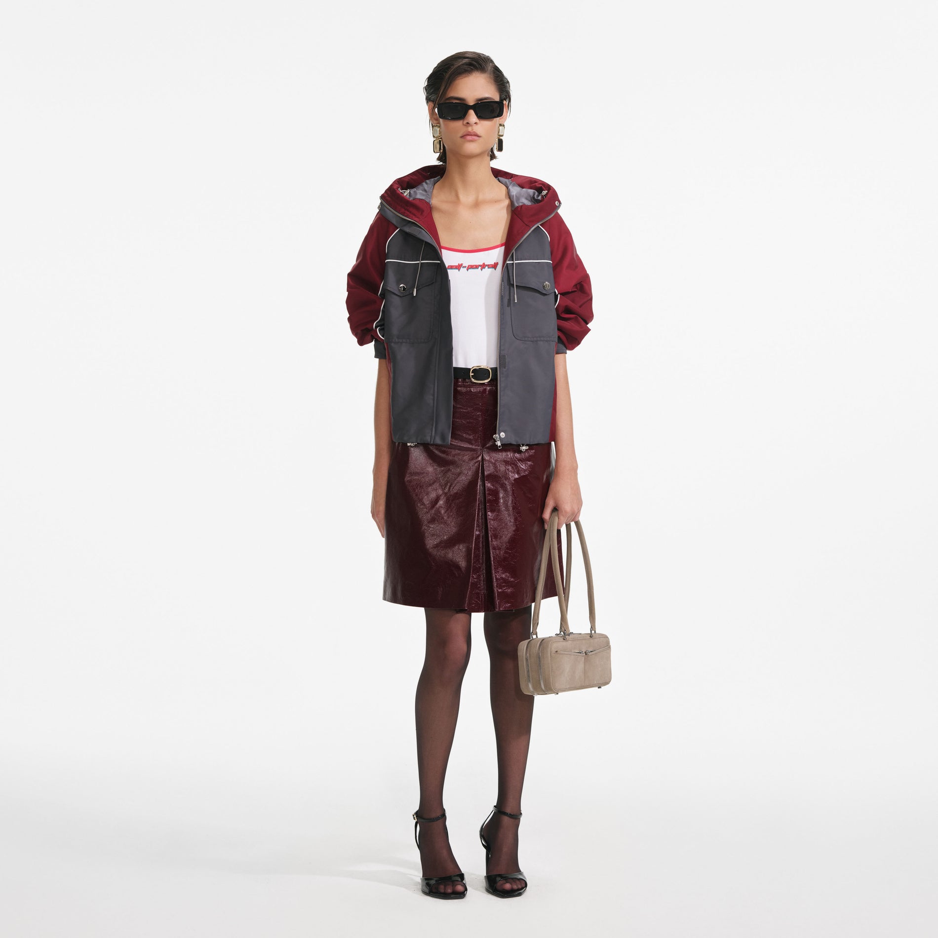 Front view of a woman wearing the Dark Grey Nylon Windbreaker