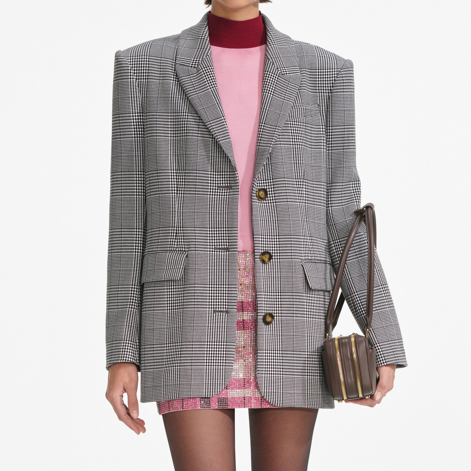 A close up of a woman wearing the Prince Of Wales Check Blazer
