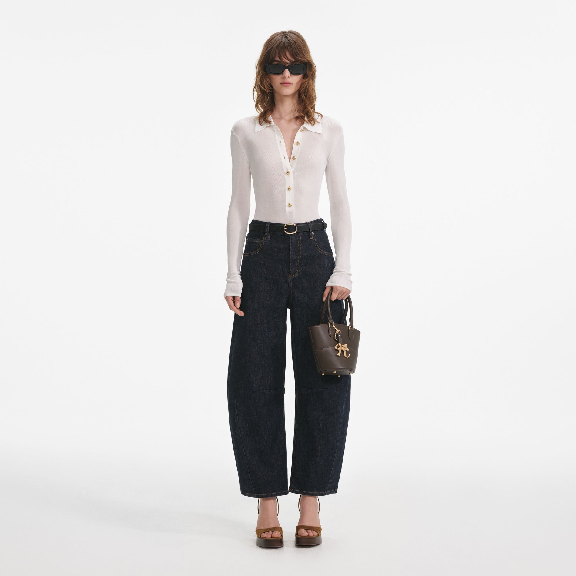 Front view of a woman wearing the White Viscose Knit Bodysuit