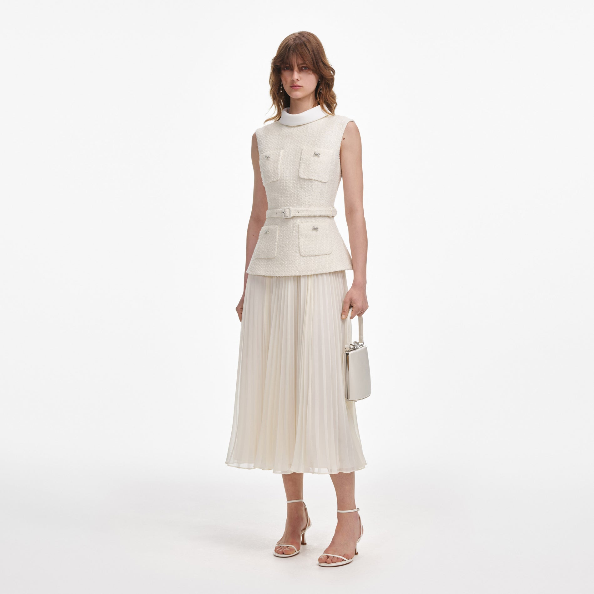 Side view of a woman wearing the Cream Boucle Sleeveless Midi Dress