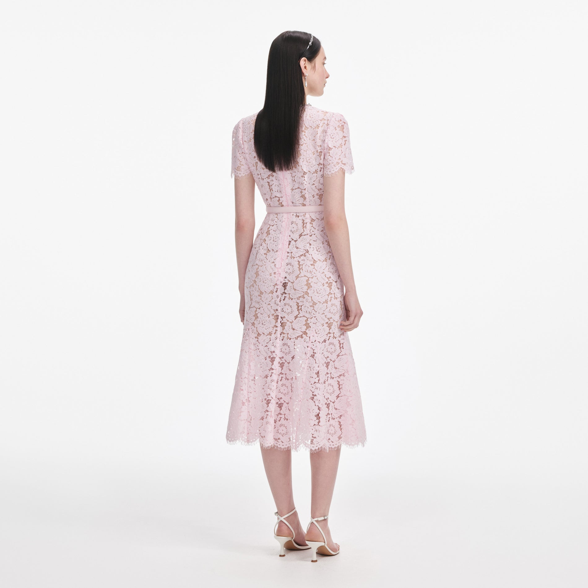Back view of a woman wearing the Pink Lace Bow Trim Midi Dress
