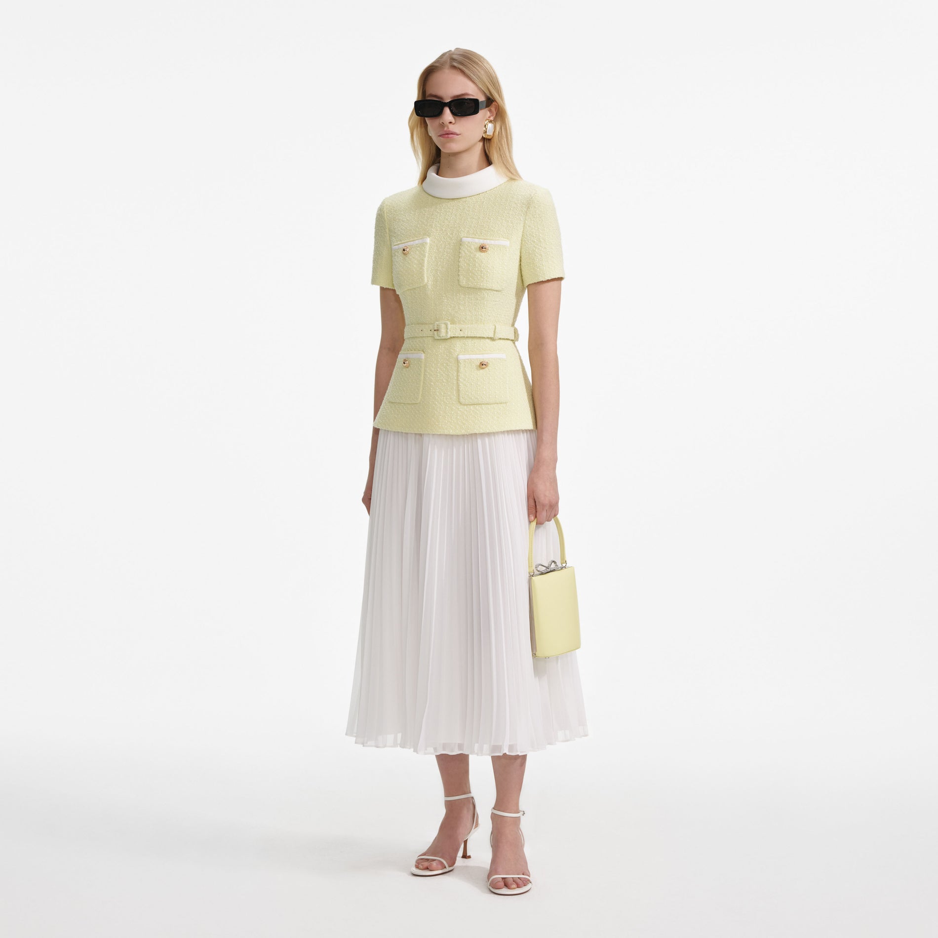 Side view of a woman wearing the Yellow Boucle Midi Dress