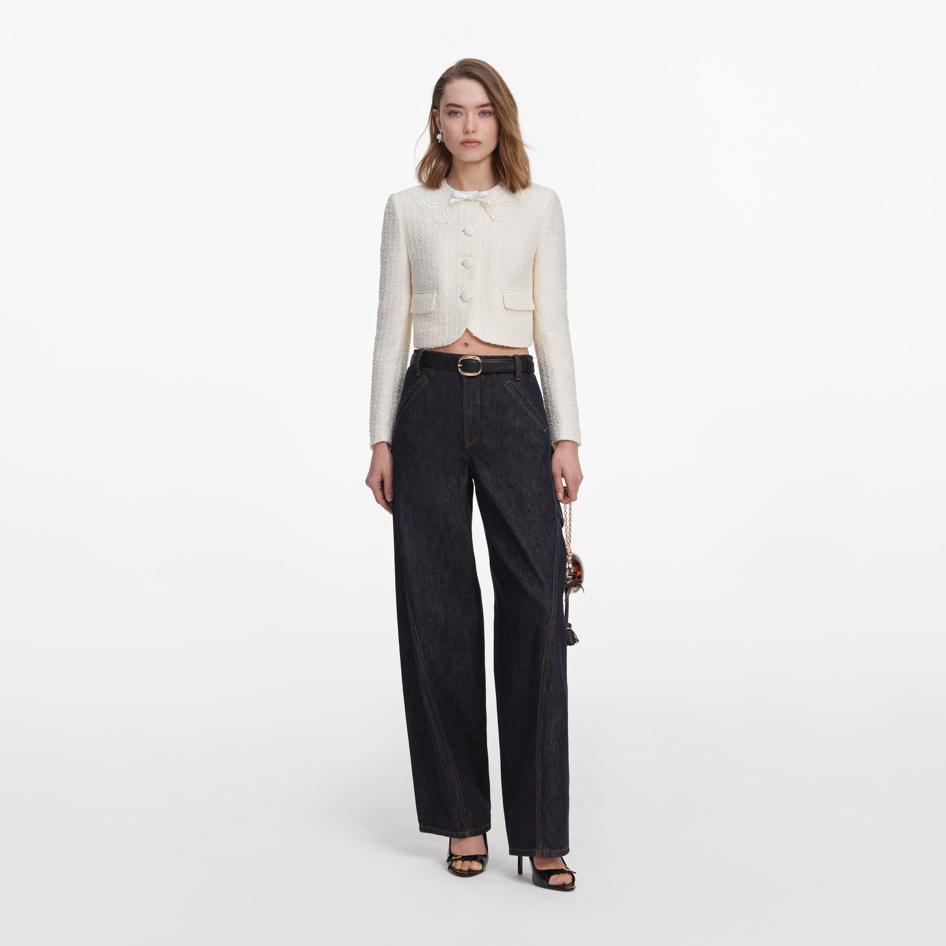 Front view of a woman wearing the Cream Boucle Lace Collar Jacket