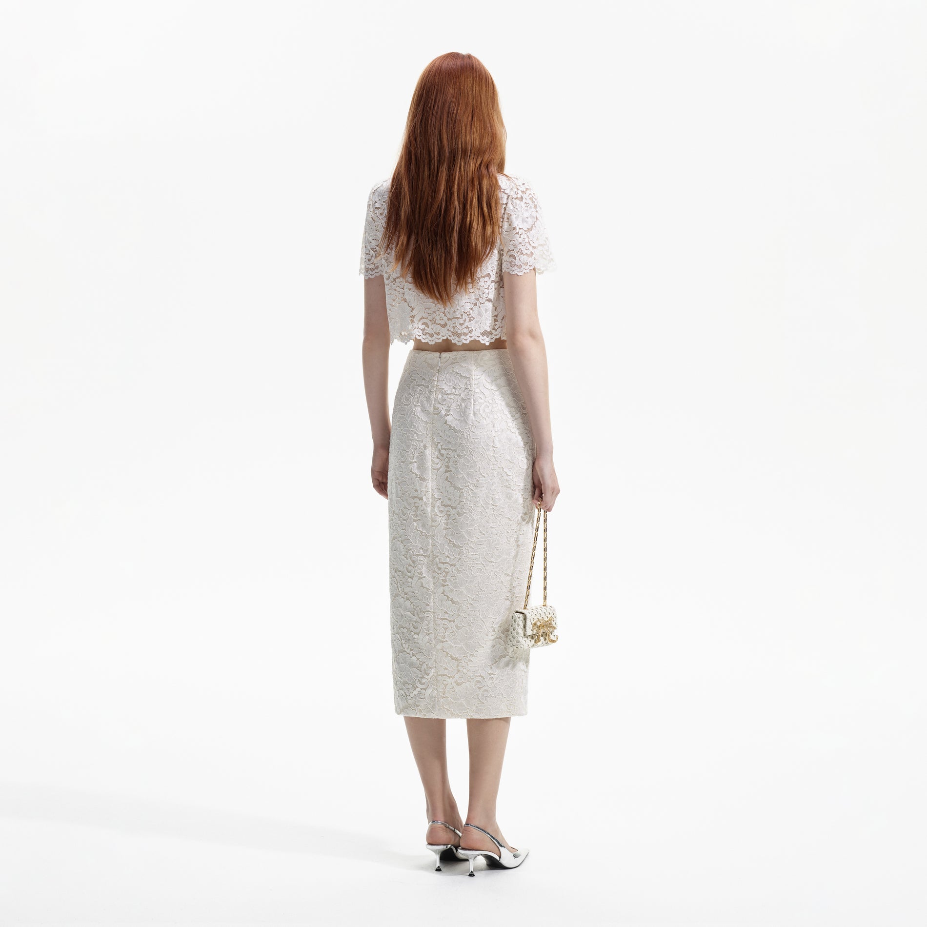 Back view of a woman wearing the Cream Cord Lace Top