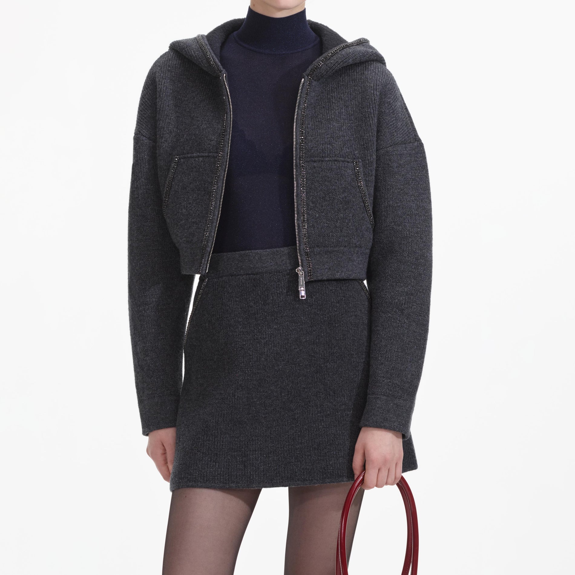 A close up of a woman wearing the Grey Knit Mini Skirt