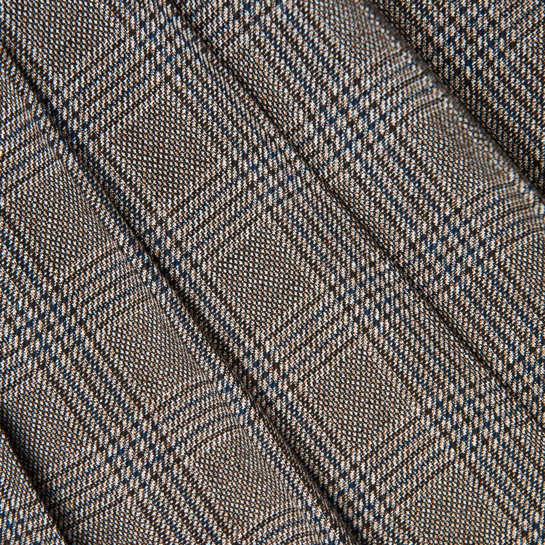 A close up of the fabric for the Brown Check Pleated Midi Skirt
