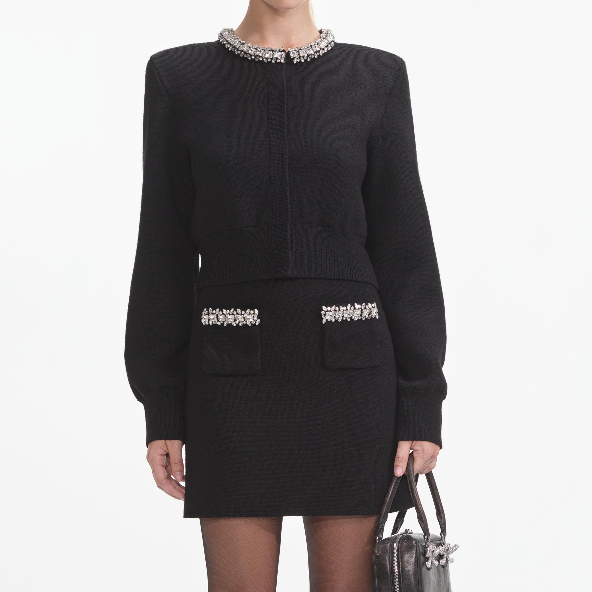 A close up of a woman wearing the Black Embellished Cardigan