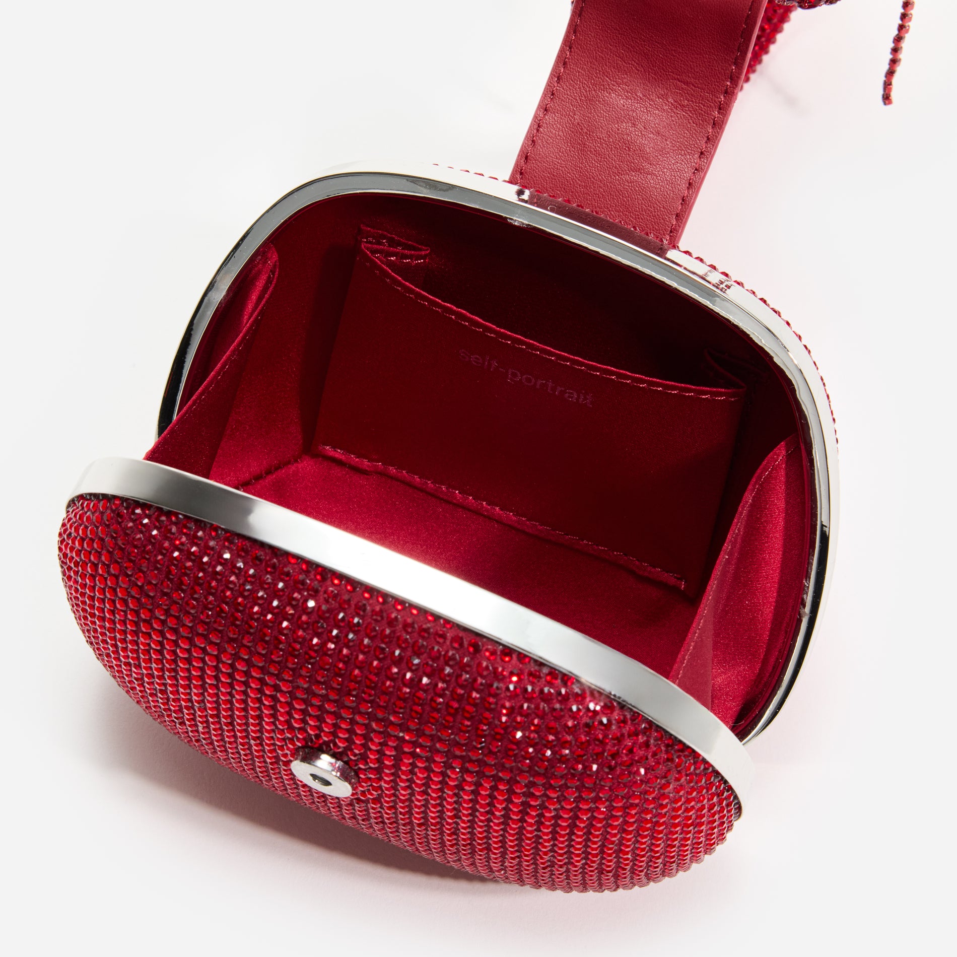 A close up of a woman wearing the Burgundy Rhinestone Top Handle Clutch Bag