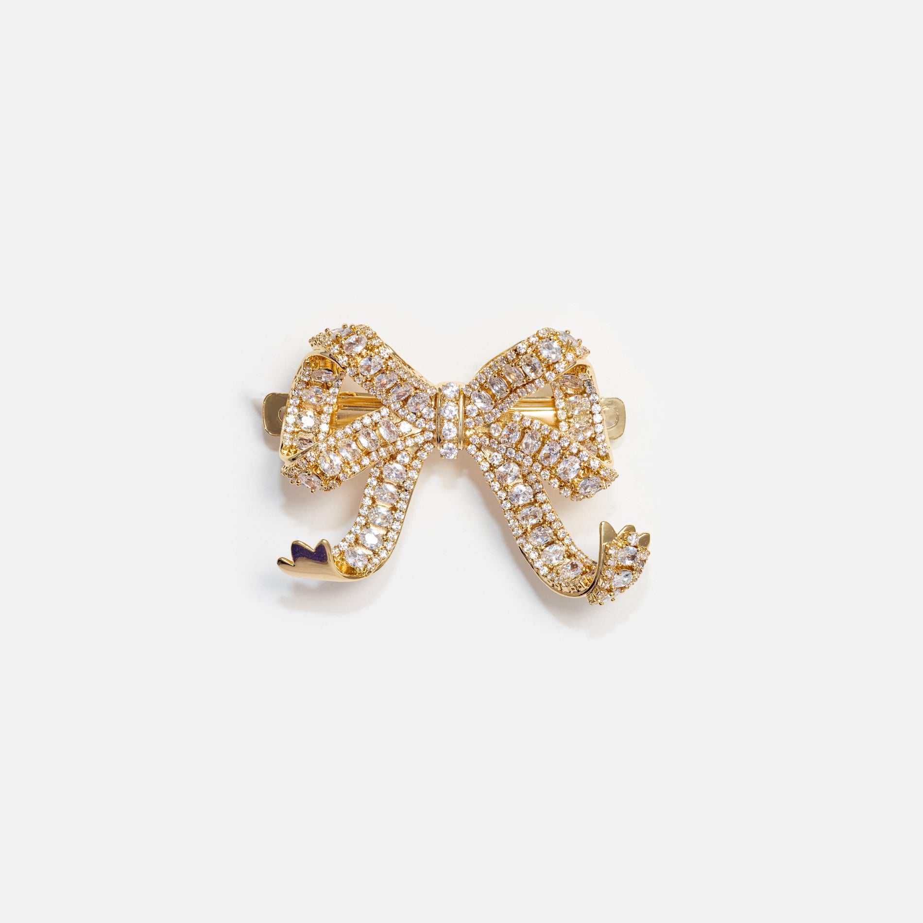 Front view of a woman wearing the Gold Crystal Bow Hair Clip