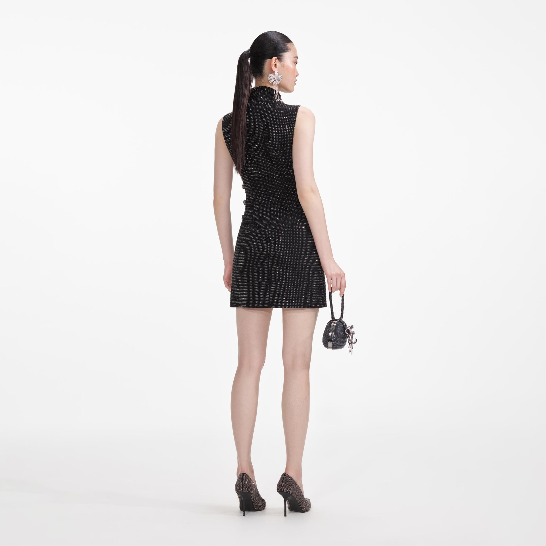 Back view of a woman wearing the Black Rhinestone Crepe Mini Dress