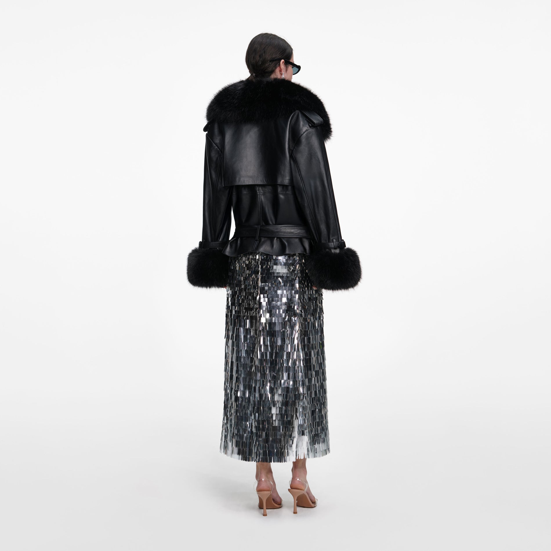 Back view of a woman wearing the Black Belted Leather Jacket