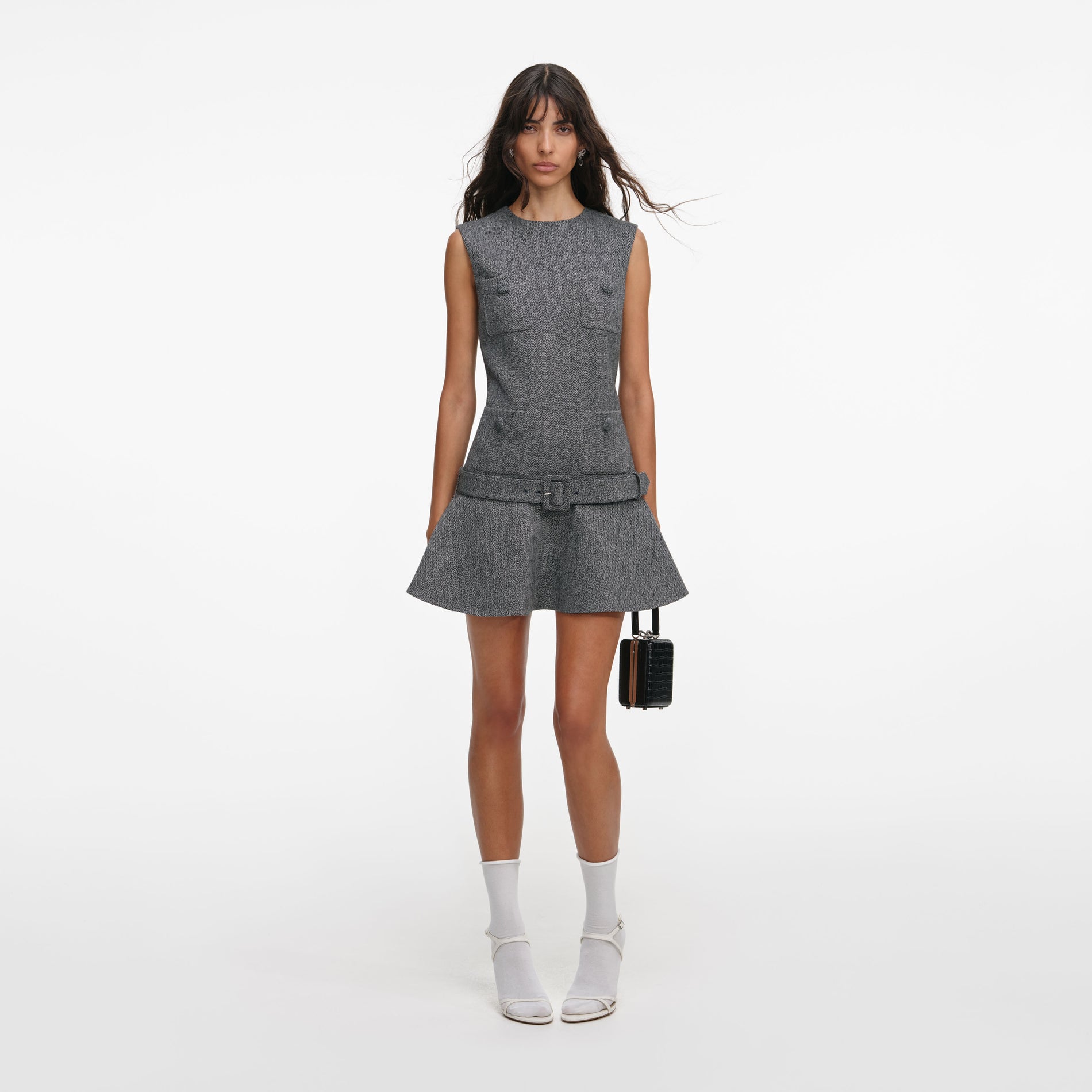 Front view of a woman wearing the Grey Herringbone Flared Mini Dress