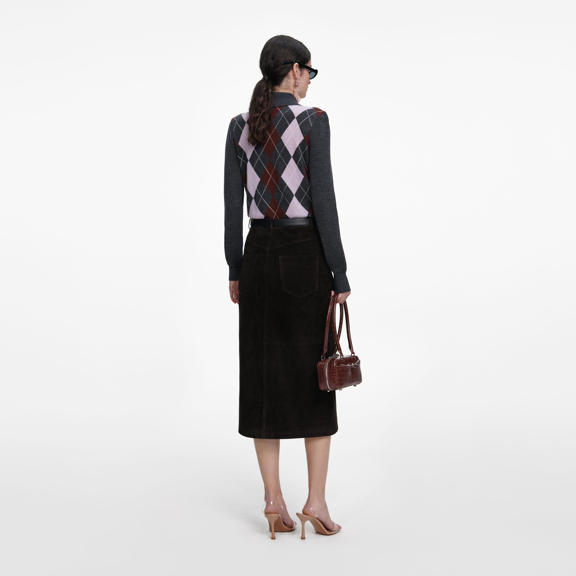 Back view of a woman wearing the Brown Suede Midi Skirt