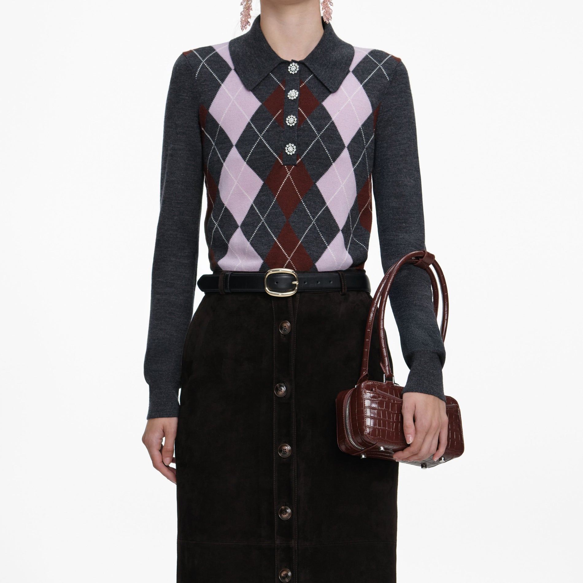 A close up of a woman wearing the Grey Argyle Lightweight Jumper