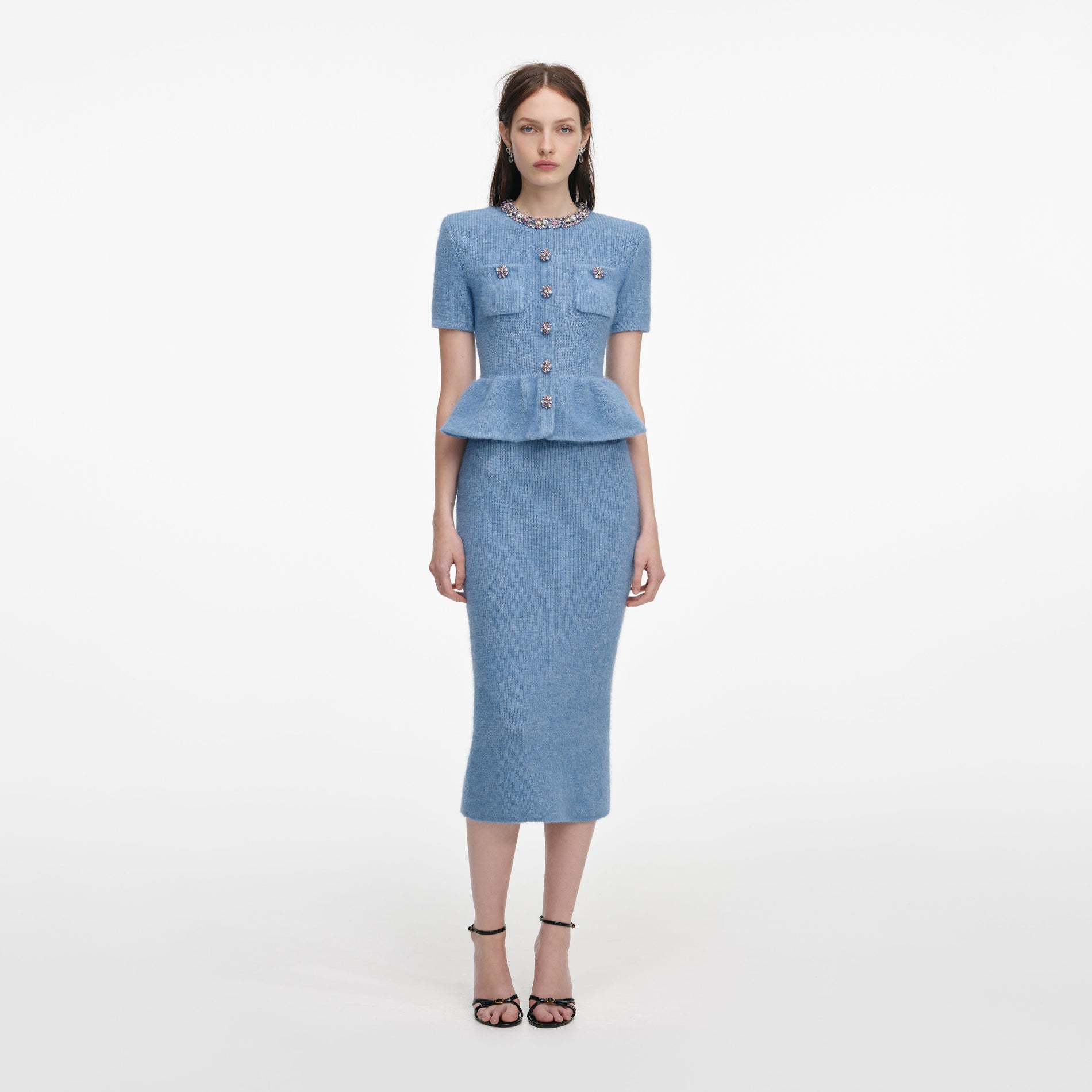 Front view of a woman wearing the Blue Peplum Knit Midi Dress