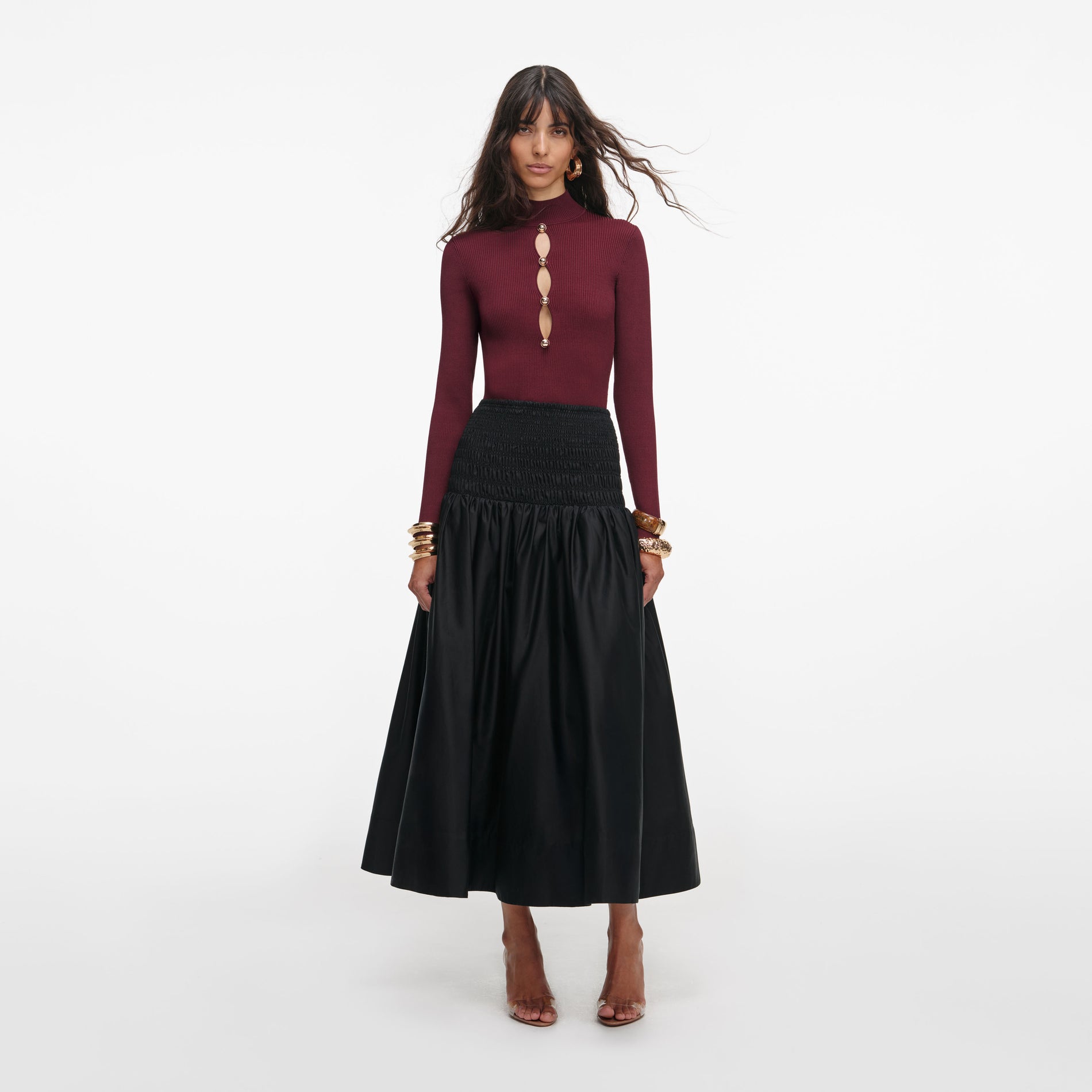 Front view of a woman wearing the Black Cotton Midi Skirt