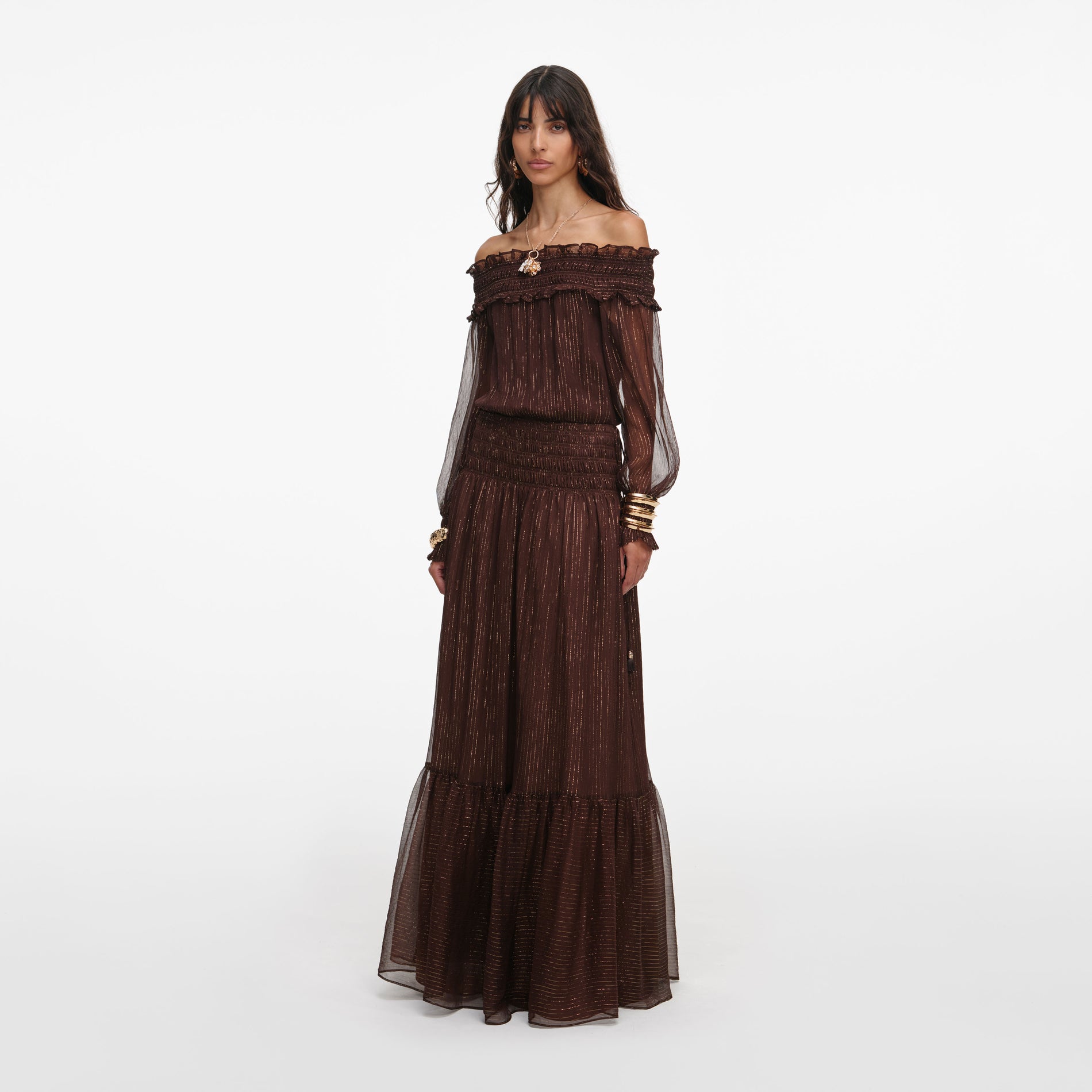 Side view of a woman wearing the Brown Georgette Maxi Dress