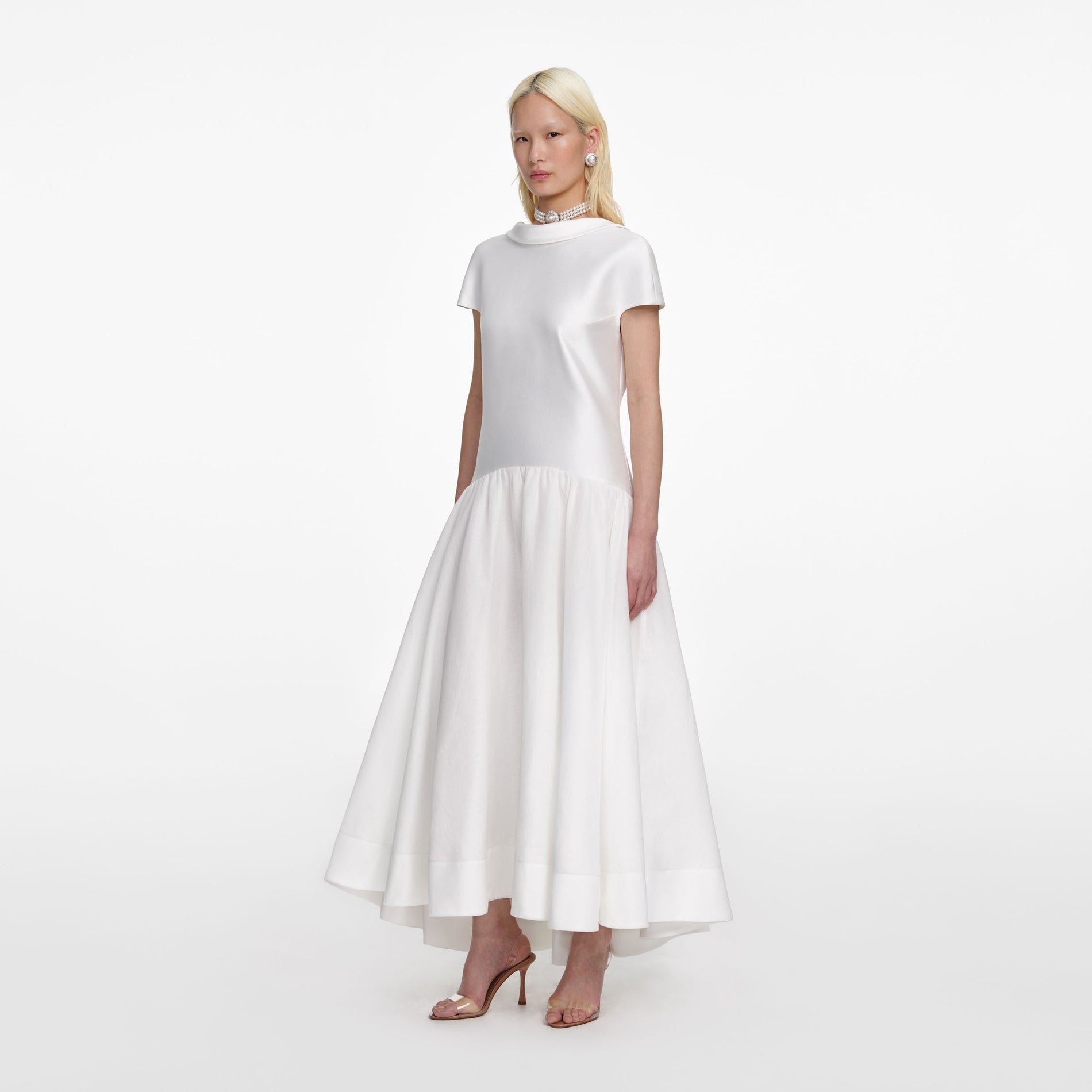 Side view of a woman wearing the White Satin Ramie Midi Dress