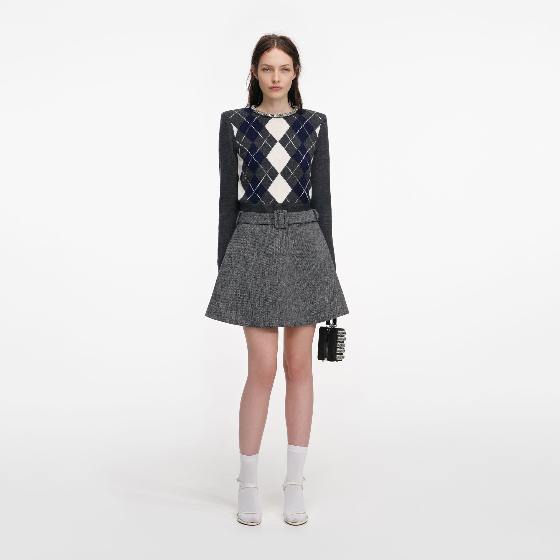 Front view of a woman wearing the Grey Argyle Crystal Trim Jumper
