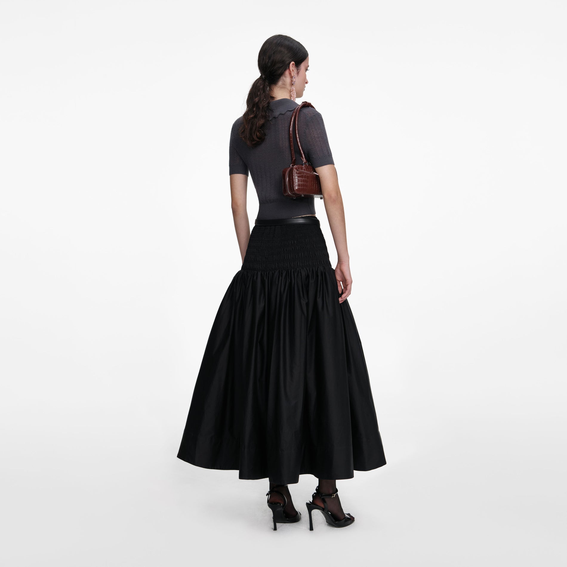 Back view of a woman wearing the Grey Embroidered Pointelle Knit Top