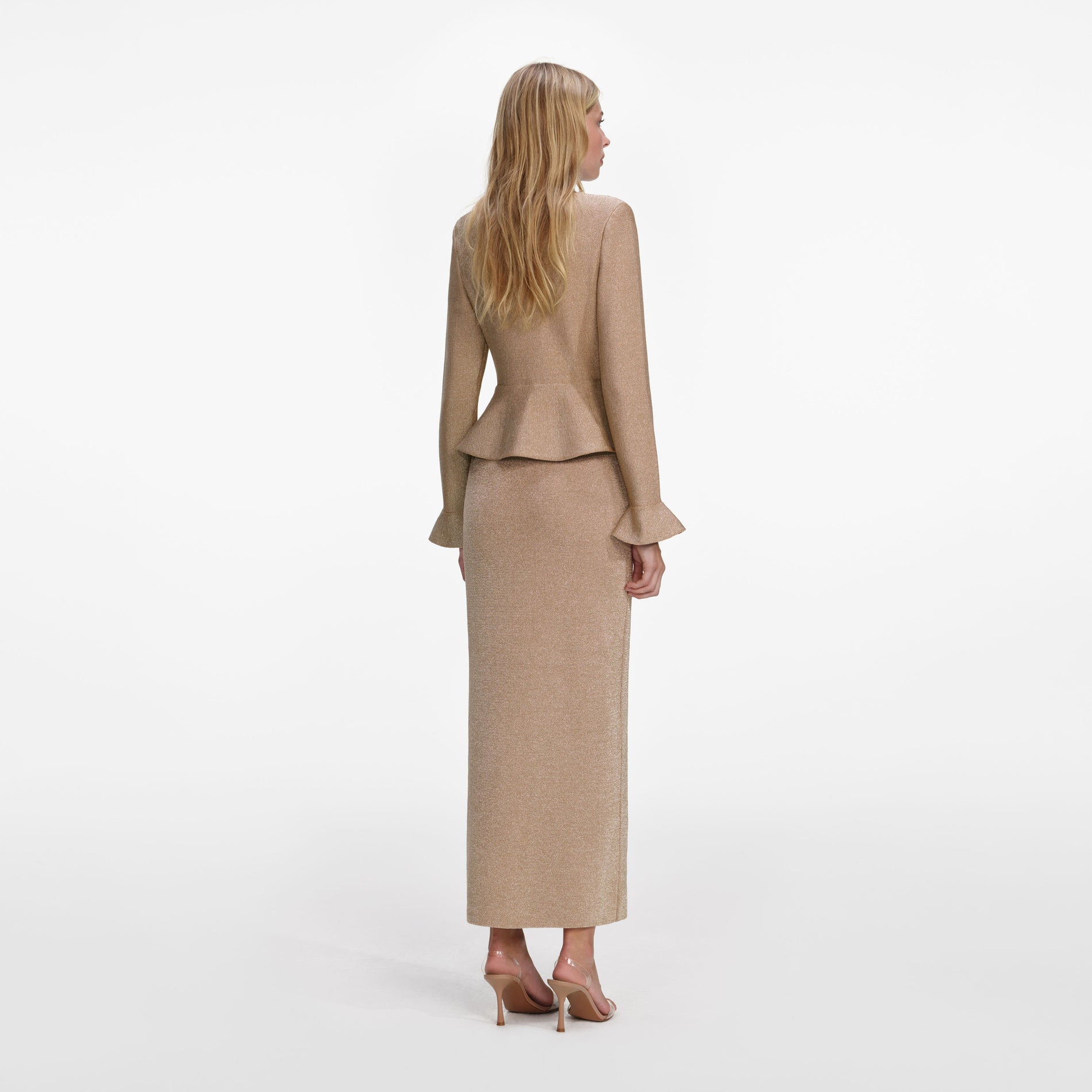 Back view of a woman wearing the Gold Crystal Trim Knit Midi Dress
