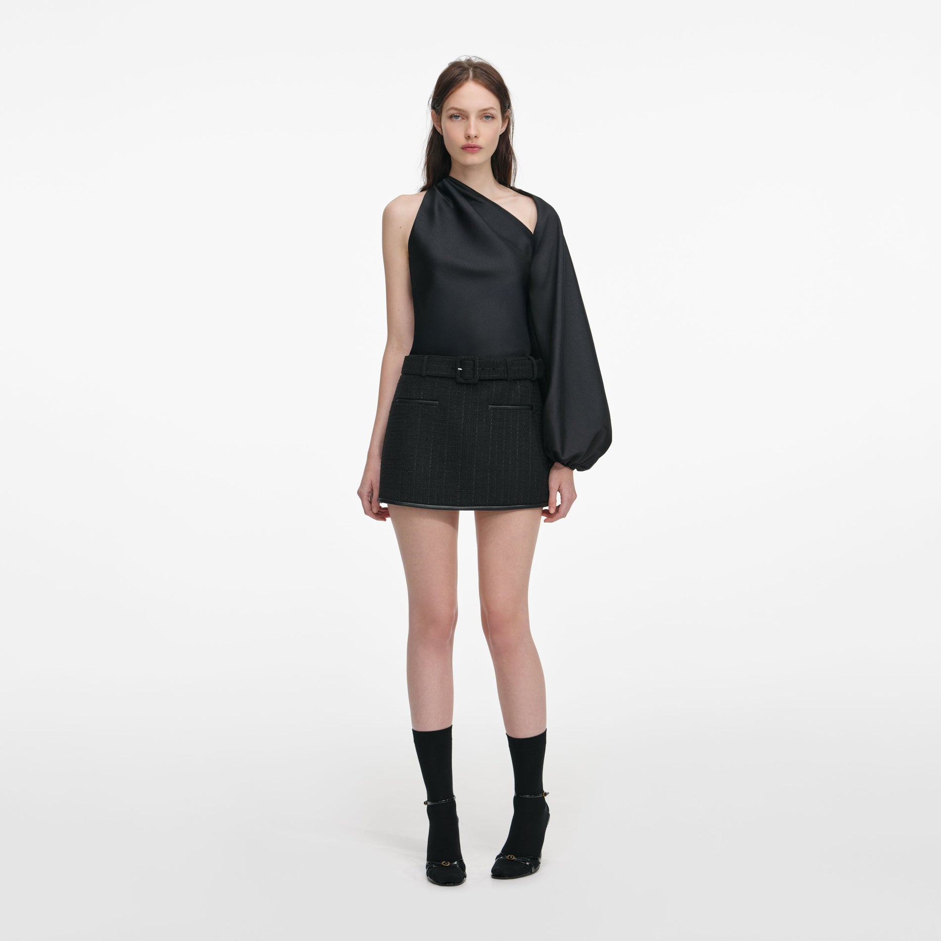 Front view of a woman wearing the Black Taffeta Draped Sleeve Top