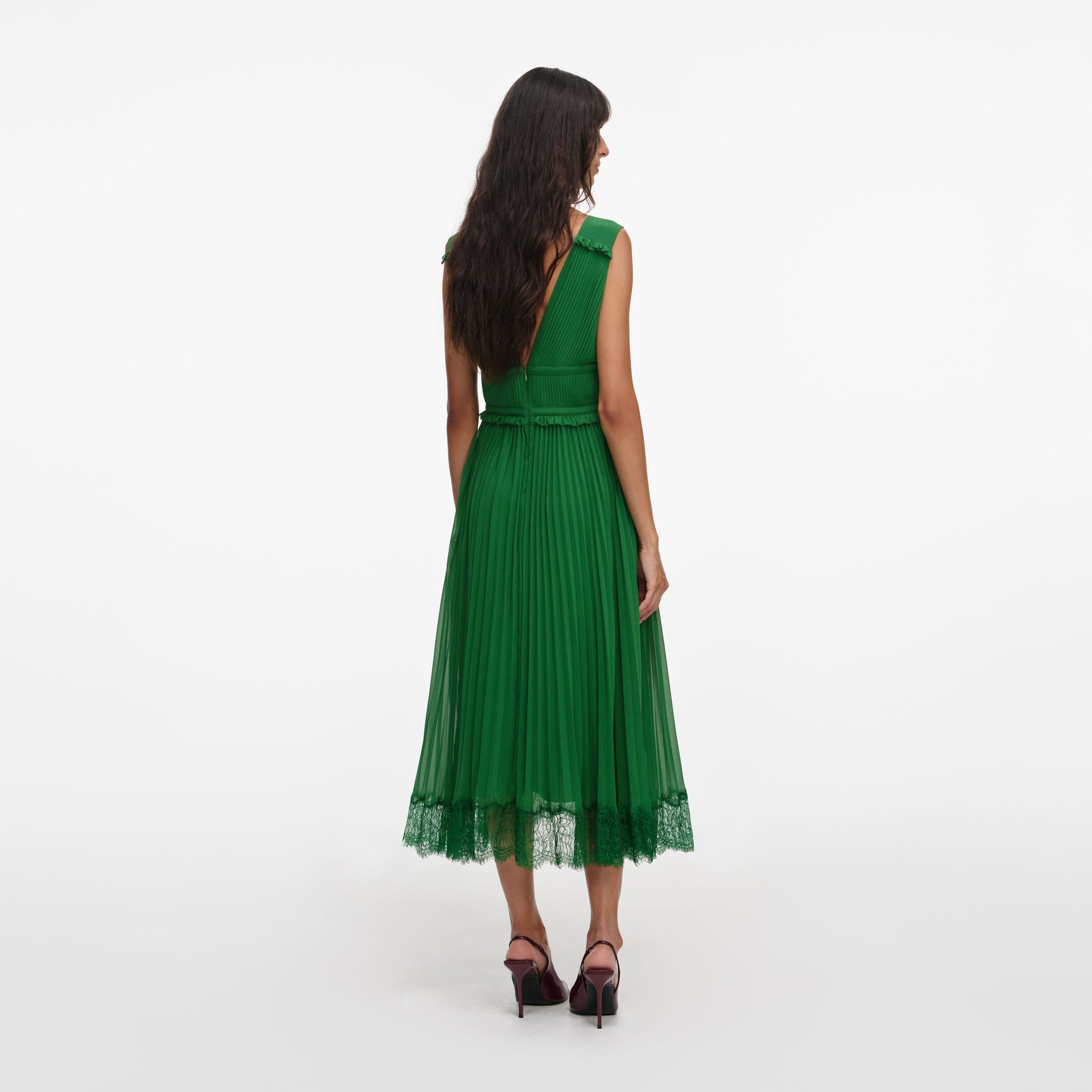 Back view of a woman wearing the Green Chiffon Midi Dress
