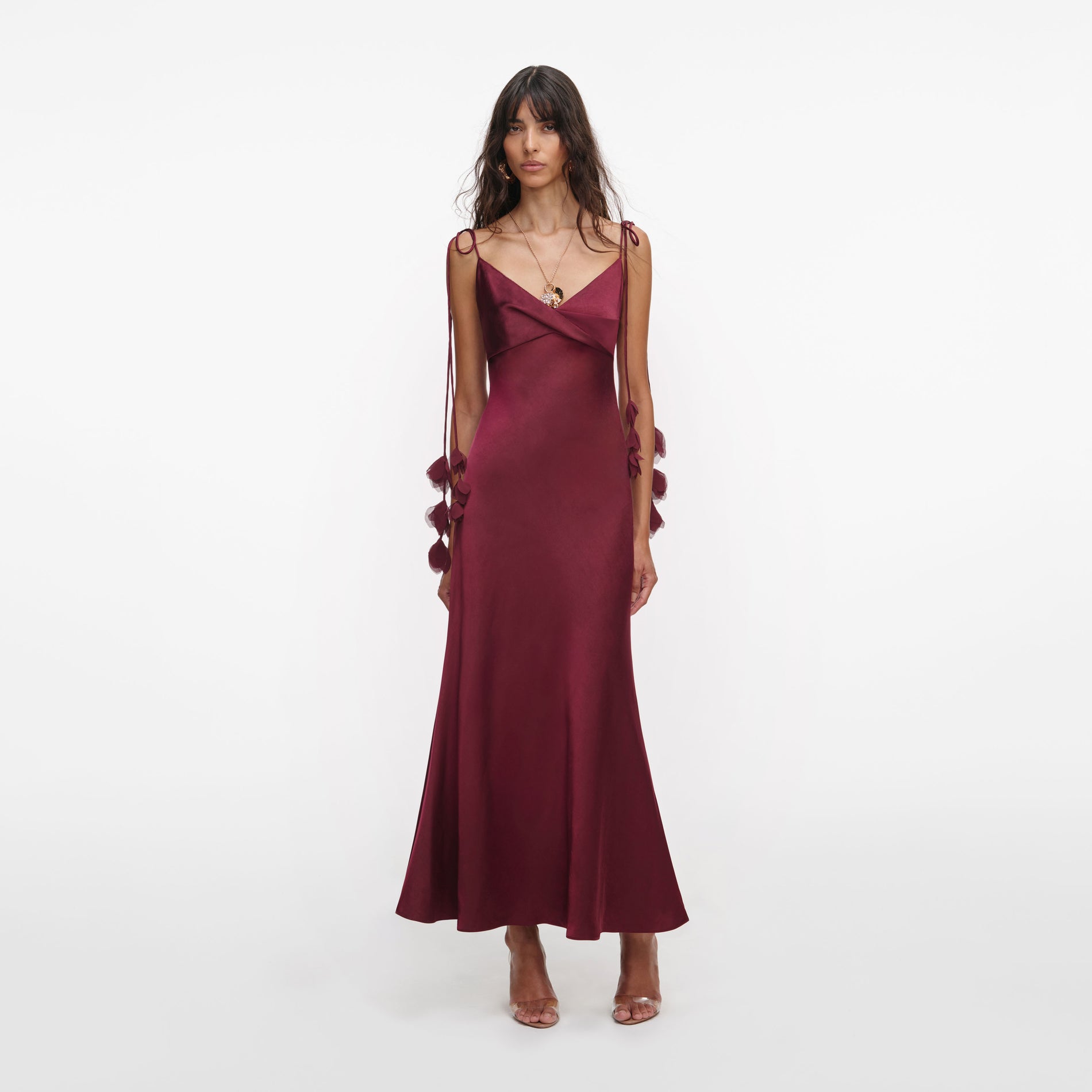 Front view of a woman wearing the Burgundy Satin Flower Midi Dress
