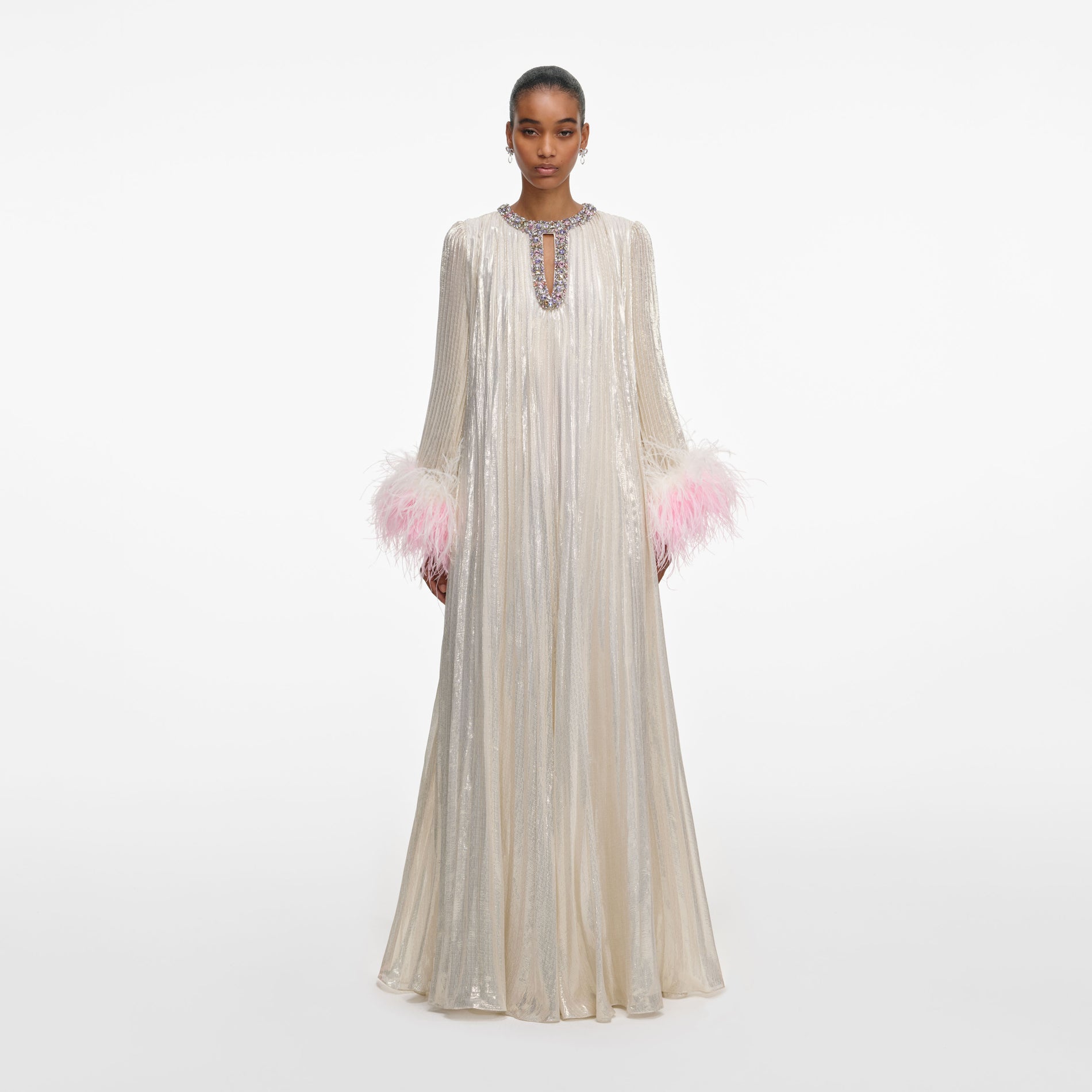 Front view of a woman wearing the Champagne Metallic Ombre Feather Maxi Dress