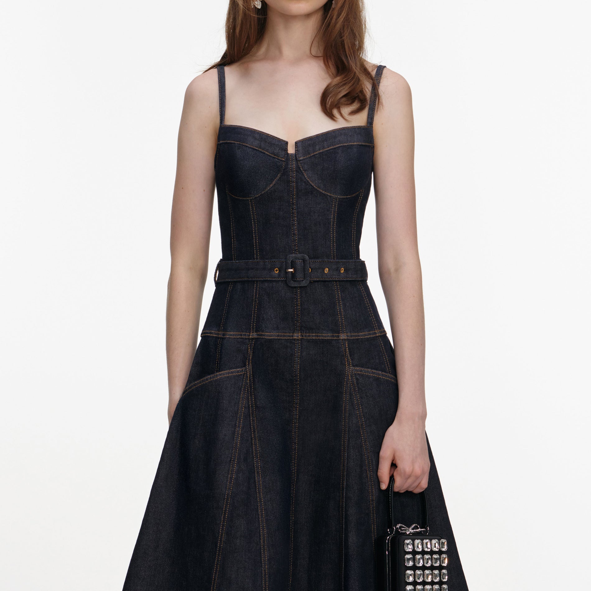 A close up of a woman wearing the Indigo Denim Flared Midi Dress
