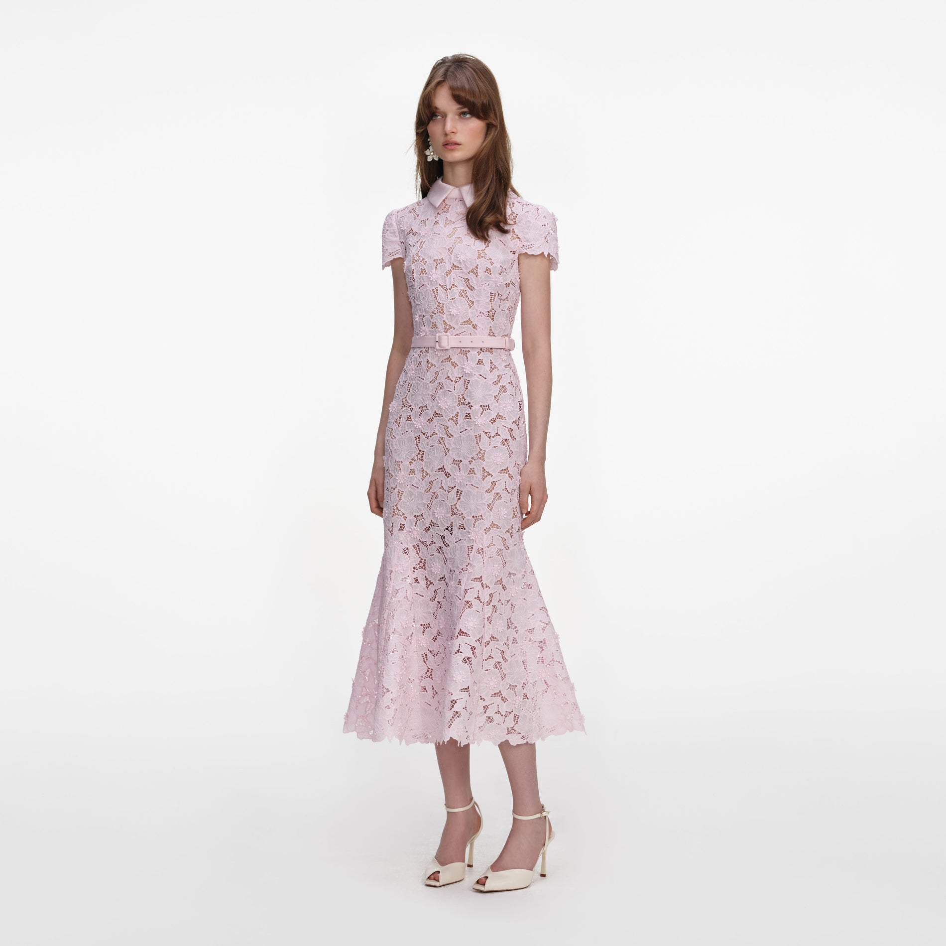 Side view of a woman wearing the Pink Guipure Lace Midi Dress
